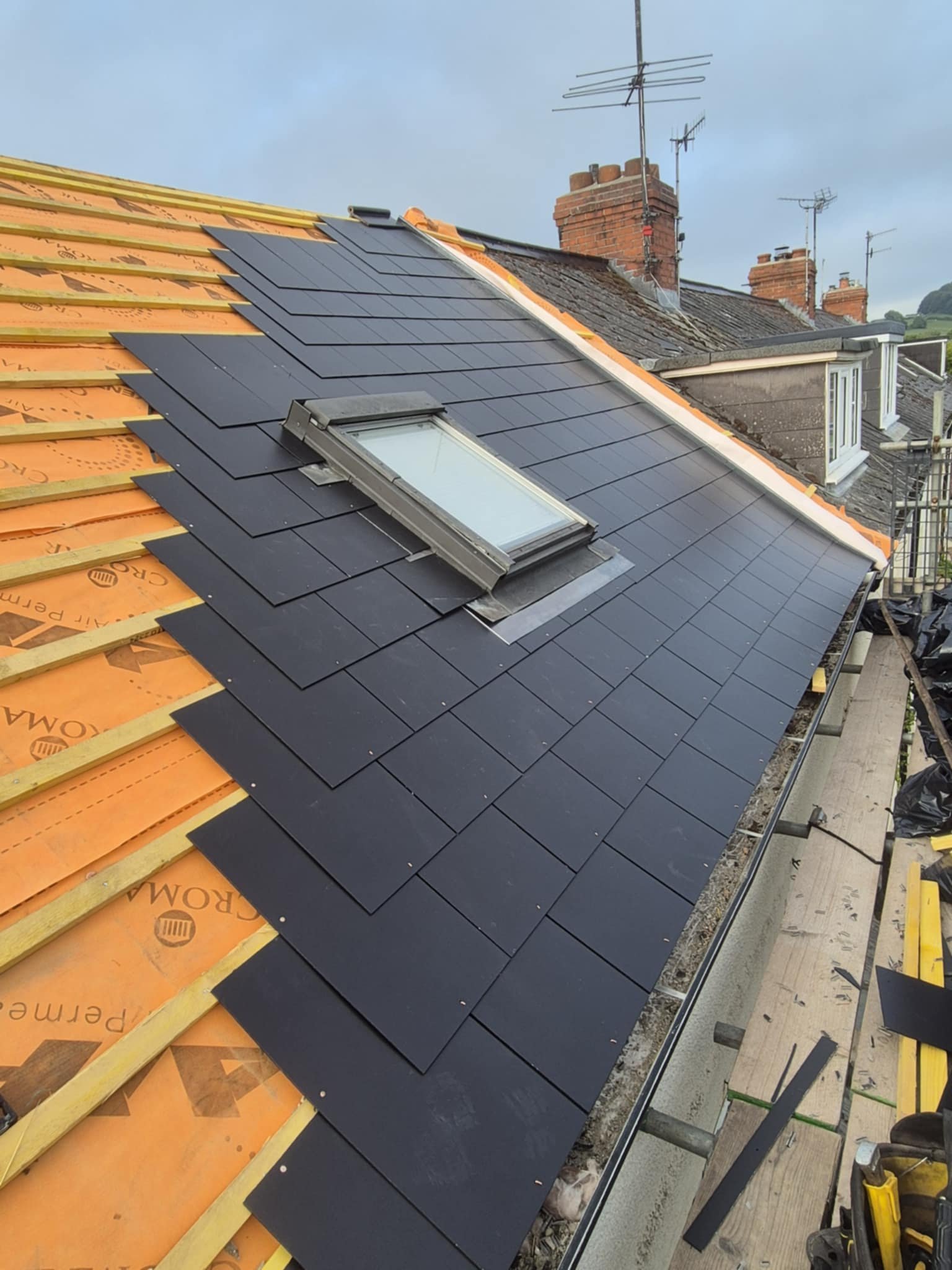 Tile re-roof with new ridge and hip work in Axminster