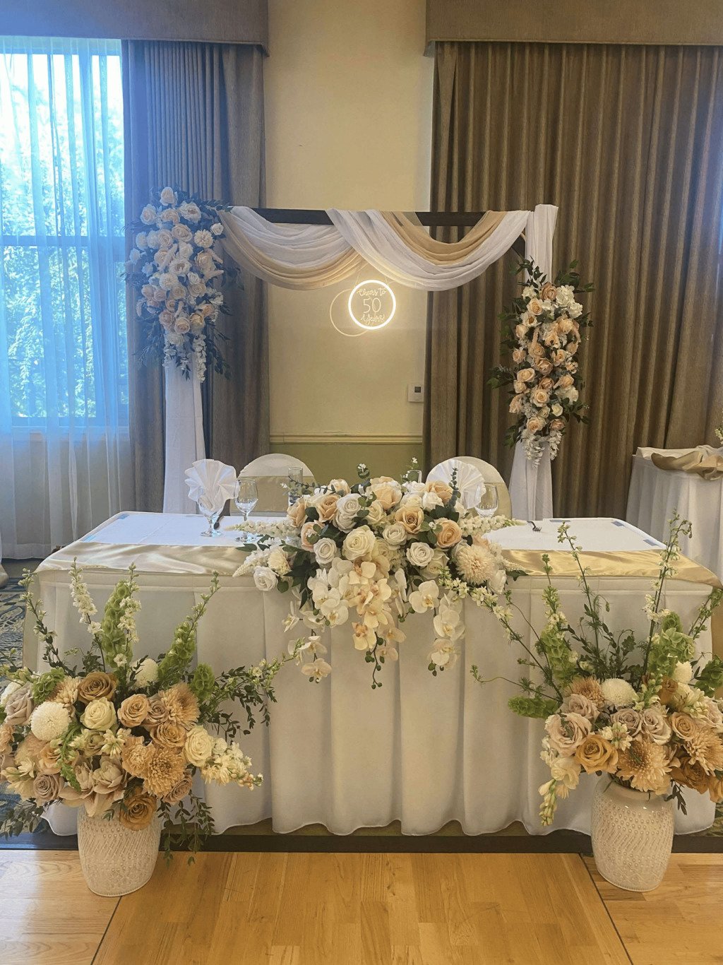 White table with flowers for an event.jpg