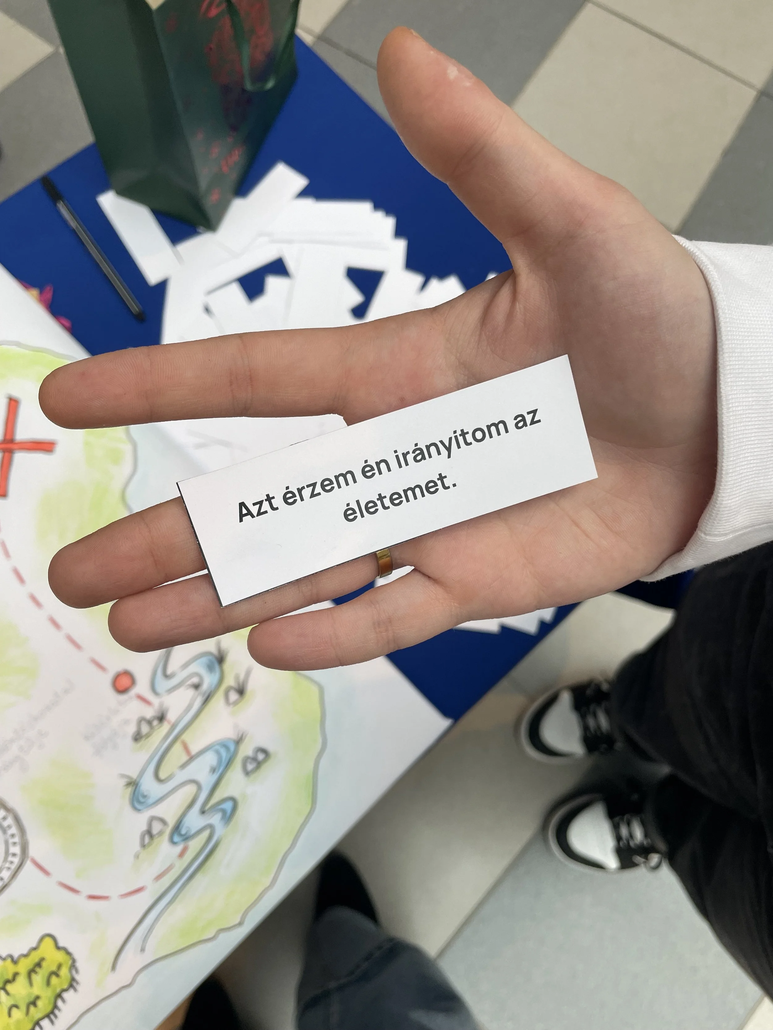 student hand with card "I am in control of my life"