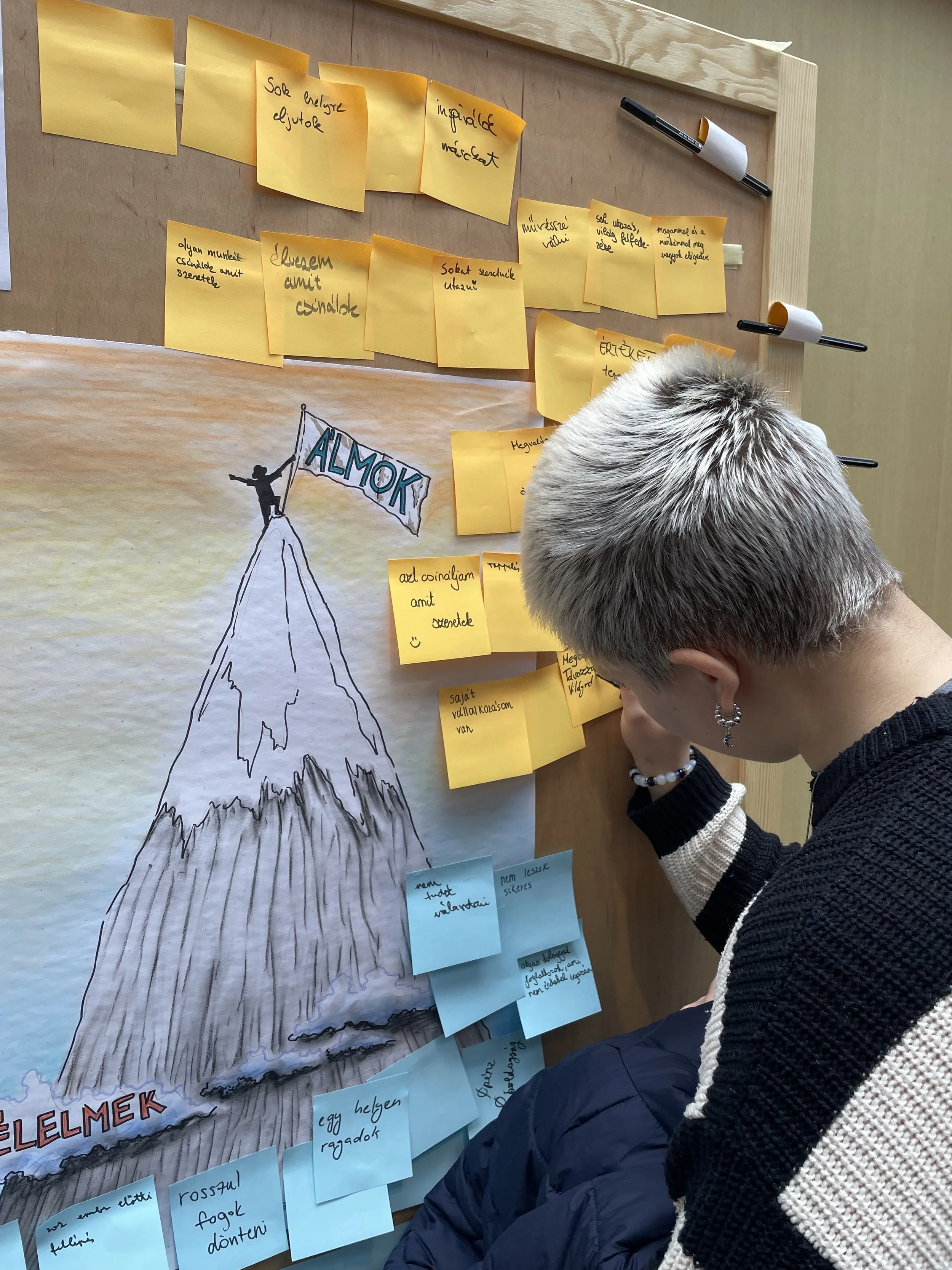 student writing her dreams and fears
