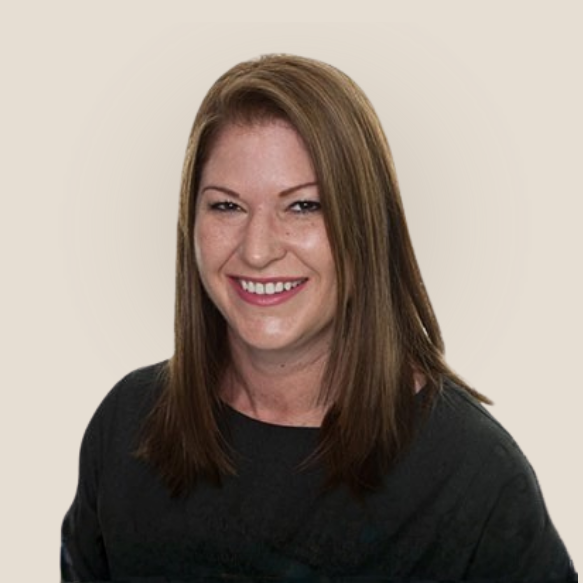 Headshot of a smiling woman with reddish-brown hair and fair skin, wearing a black top. Her name is Karen Thomas
