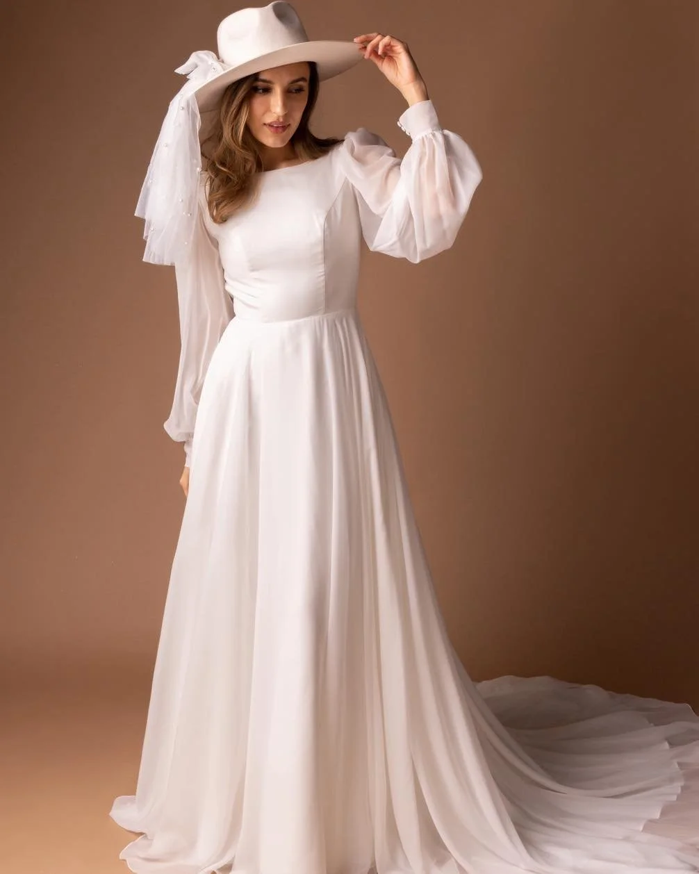 From the delicate sleeves to the open back and button detail, every angle gives you something to fall in love with. Effortless, feminine, and just a little unexpected✨

If you&rsquo;ve been picturing something timeless with a twist, this might be the