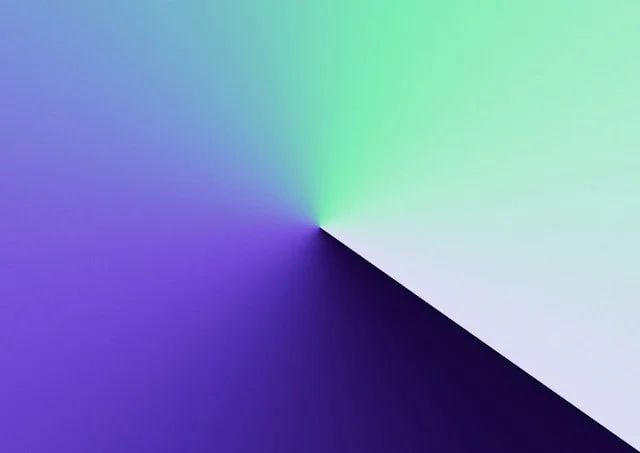 Colorful gradient with a vortex pattern, transitioning through green, blue, purple, and black.