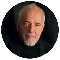 Portrait of author Paulo Coelho with a white beard and black turtleneck, featured as an endorser of Gary Zukav's book The Seat of the Soul.