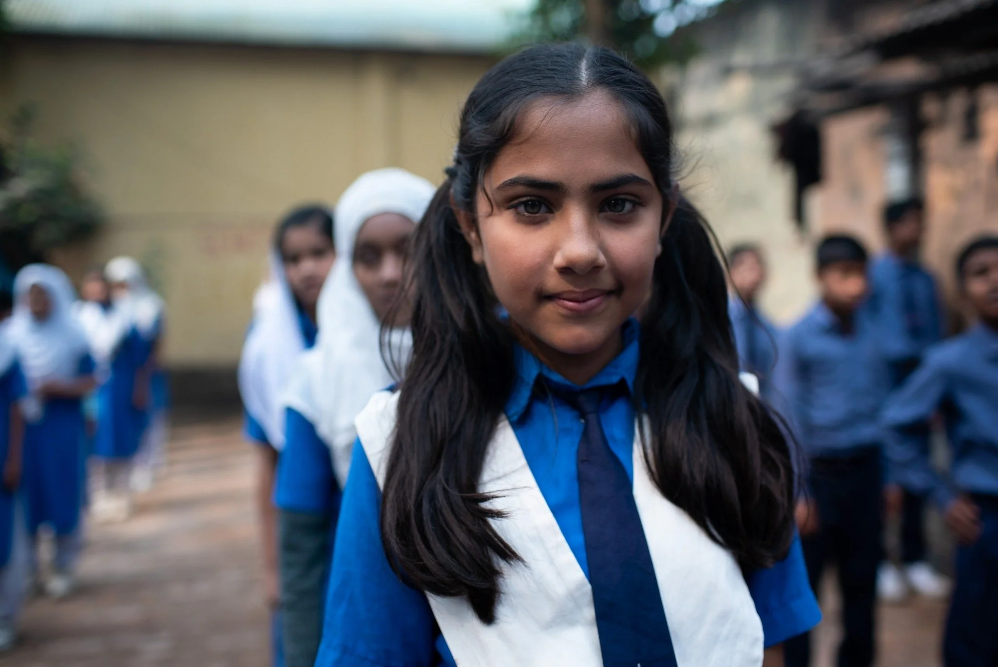Children and OBAT Helpers volunteers together in a Bangladesh camp community