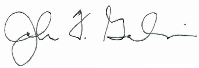 Handwritten signature on white paper.