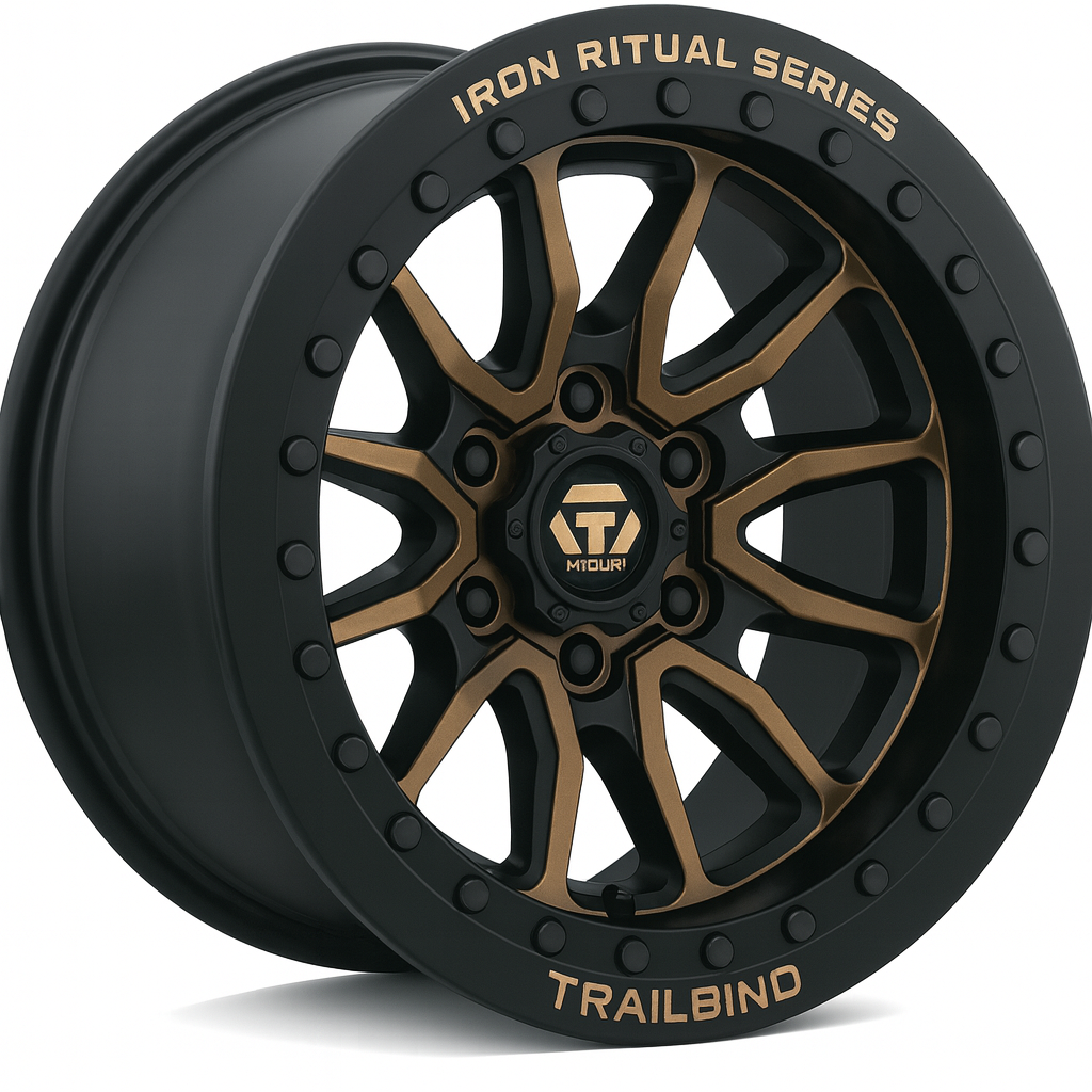 A black and gold off-road vehicle wheel rim with the words 'IRON RITUAL SERIES' on the outer rim and 'TRAILBIND' at the bottom.