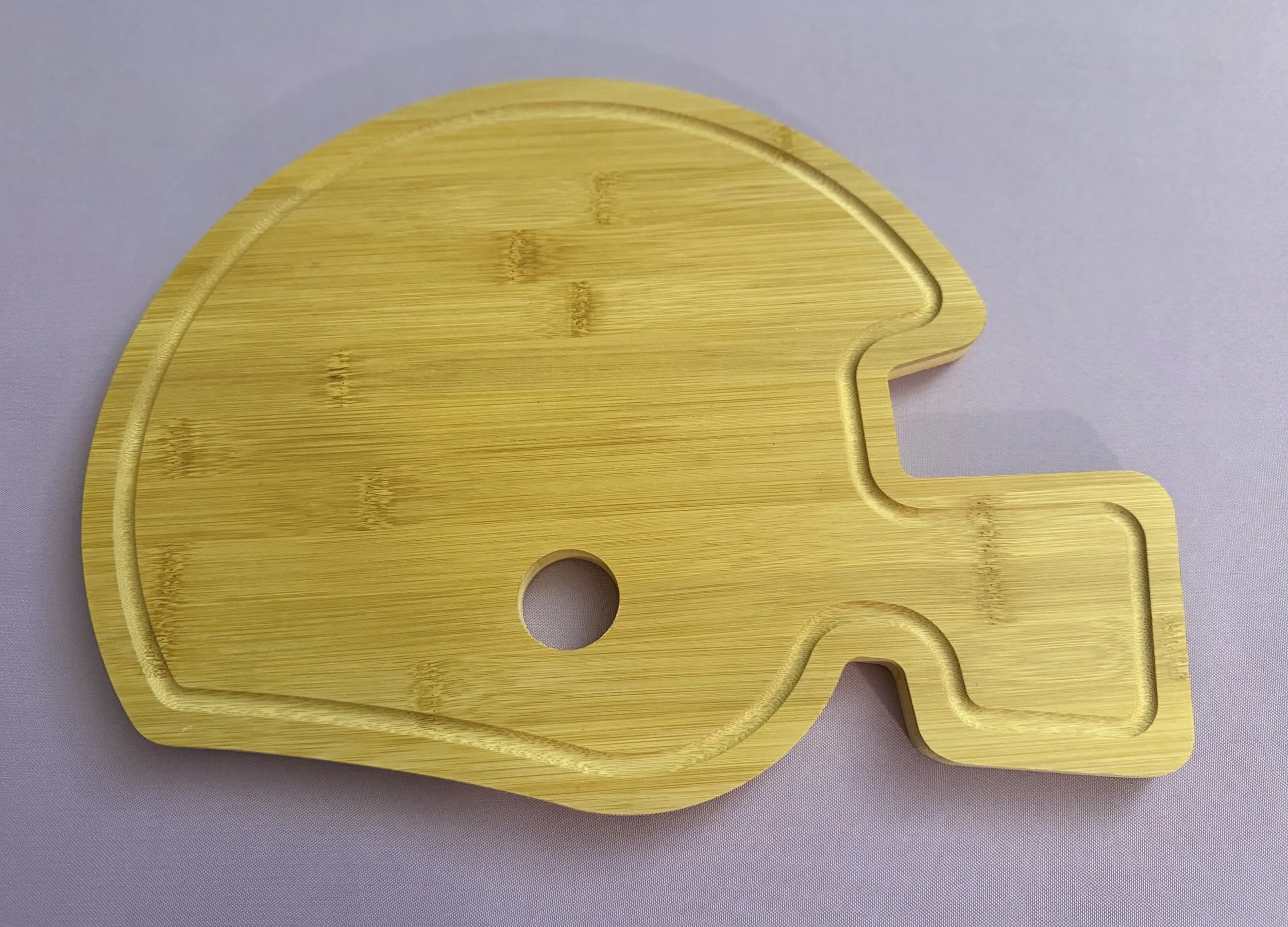 Football helmet serving board