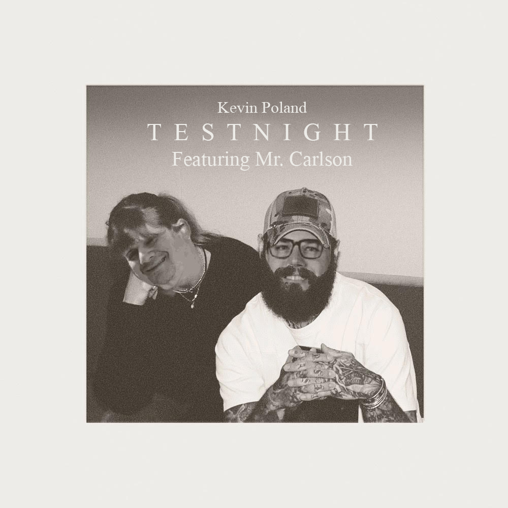 Black and white photo of two men, one with glasses and a cap, and the other with sunglasses, laughing together. Text overlay: 'Kevin Poland TESTNIGHT Featuring Mr. Carlson'.