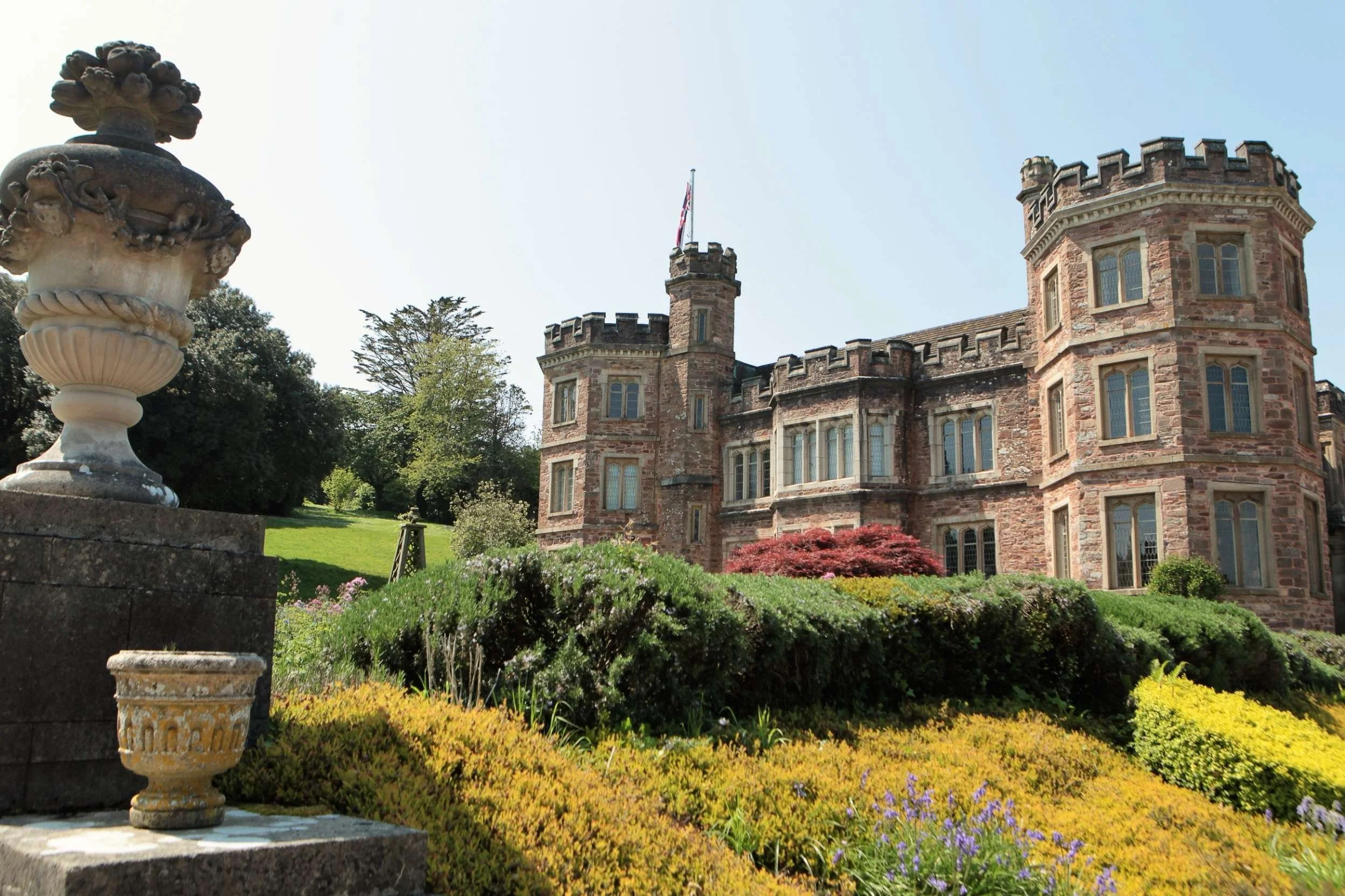 Coour photo of odern da Mount Edgcumbe House against blue sky