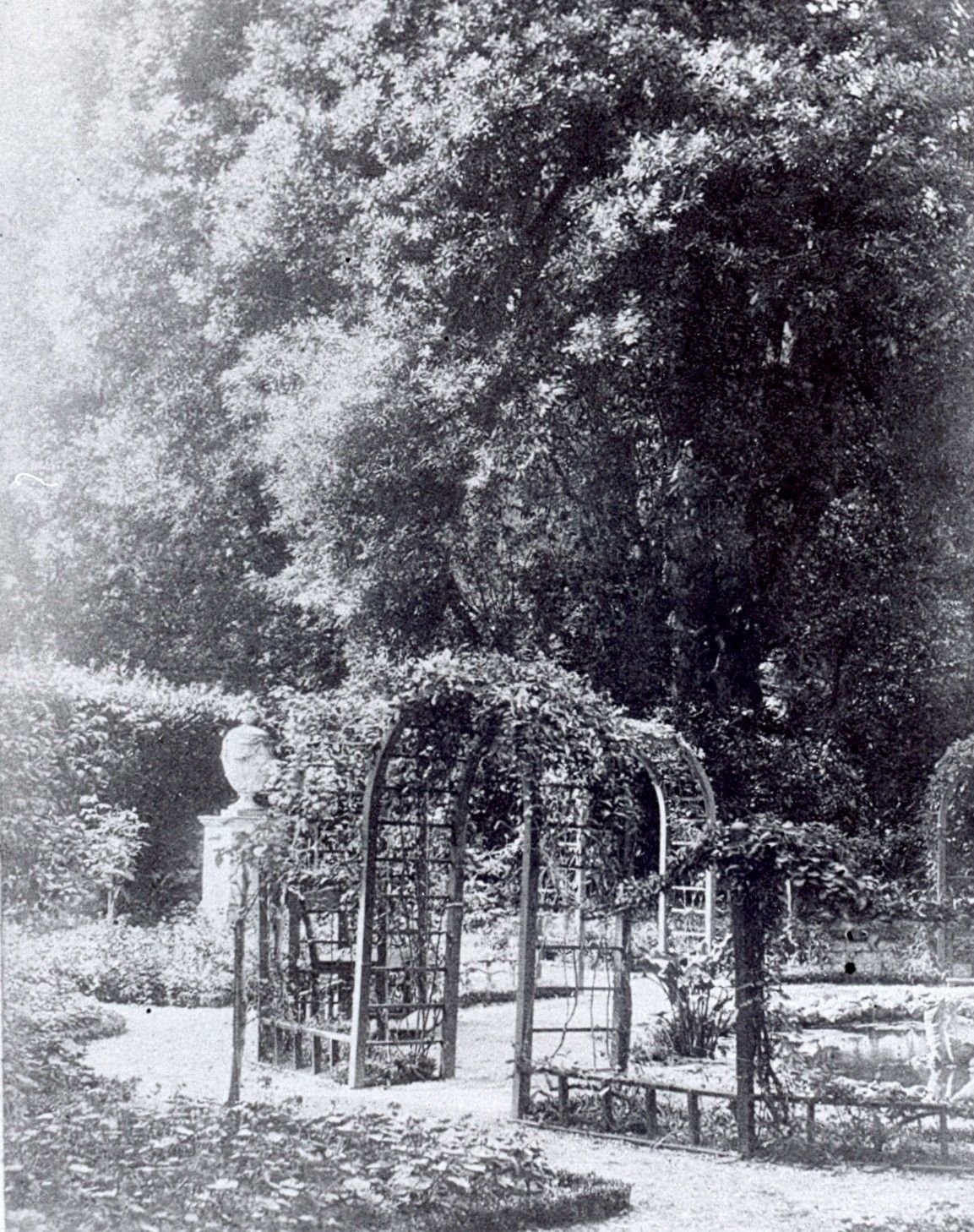 Early black and white photo provides a sense of how the romantic sentiment in the French garden was generated with trellises and plants.