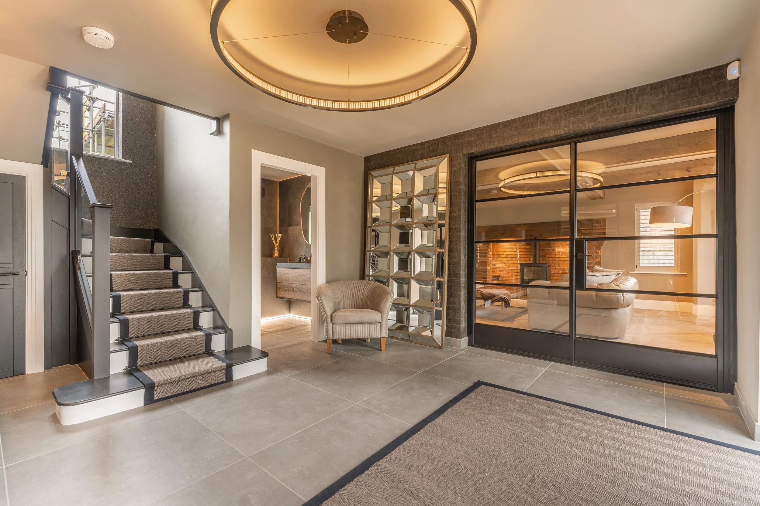 Luxury smart home entrance with architectural lighting and automated lighting control in Derbyshire property