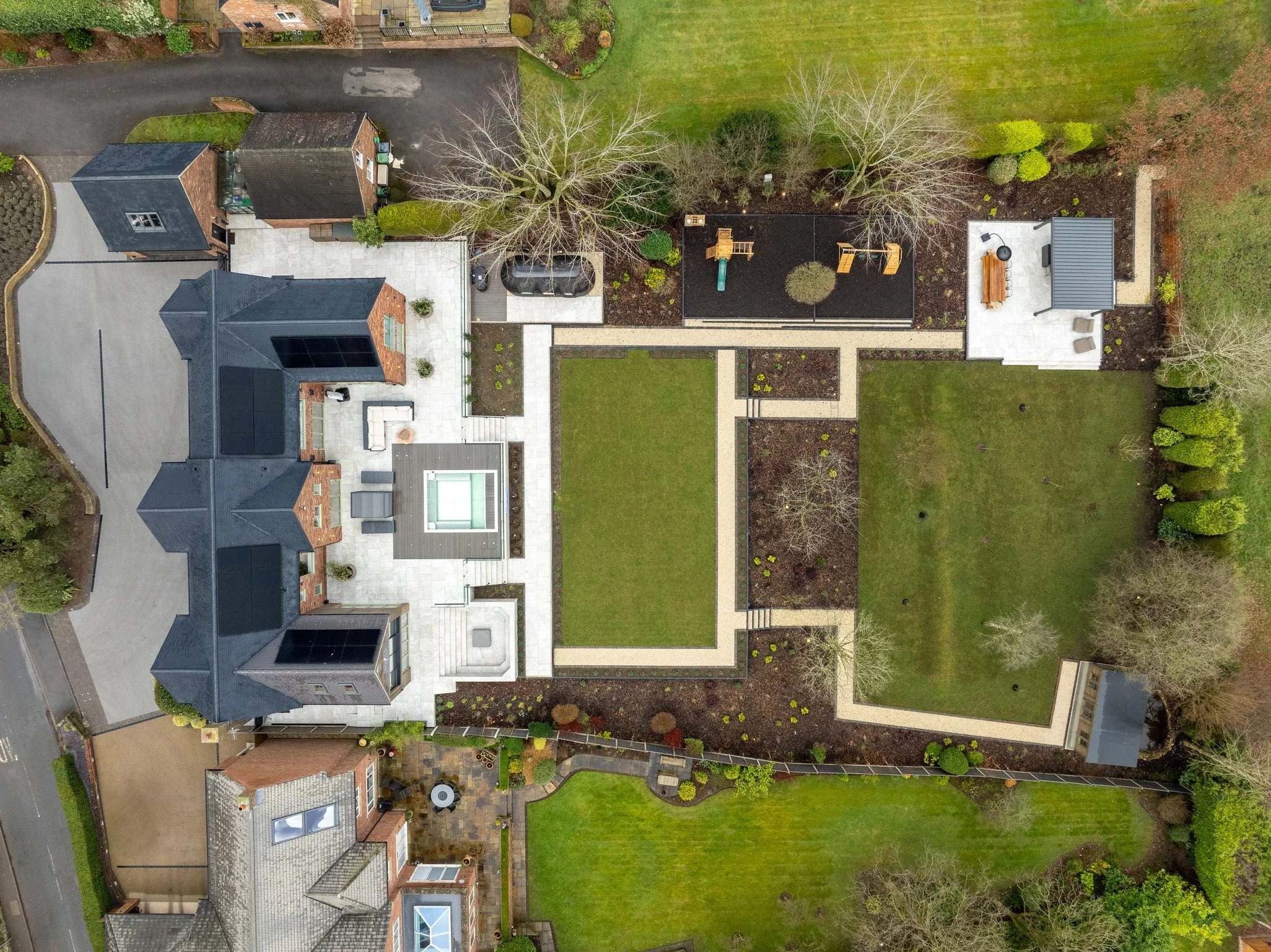 Aerial view of luxury landscaped garden with integrated smart garden lighting and outdoor technology in Derbyshire