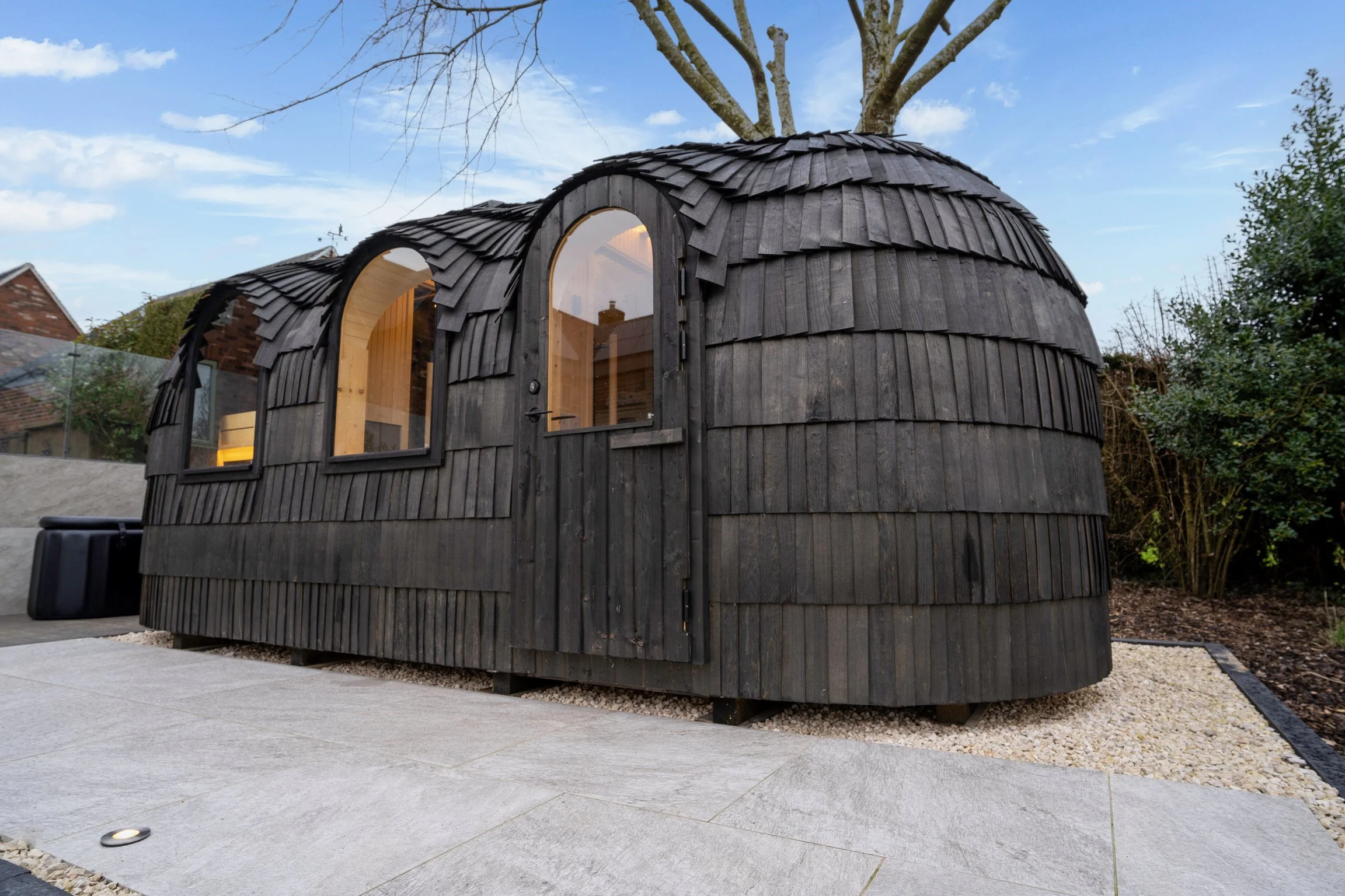 Luxury outdoor garden building with integrated lighting and smart home connectivity