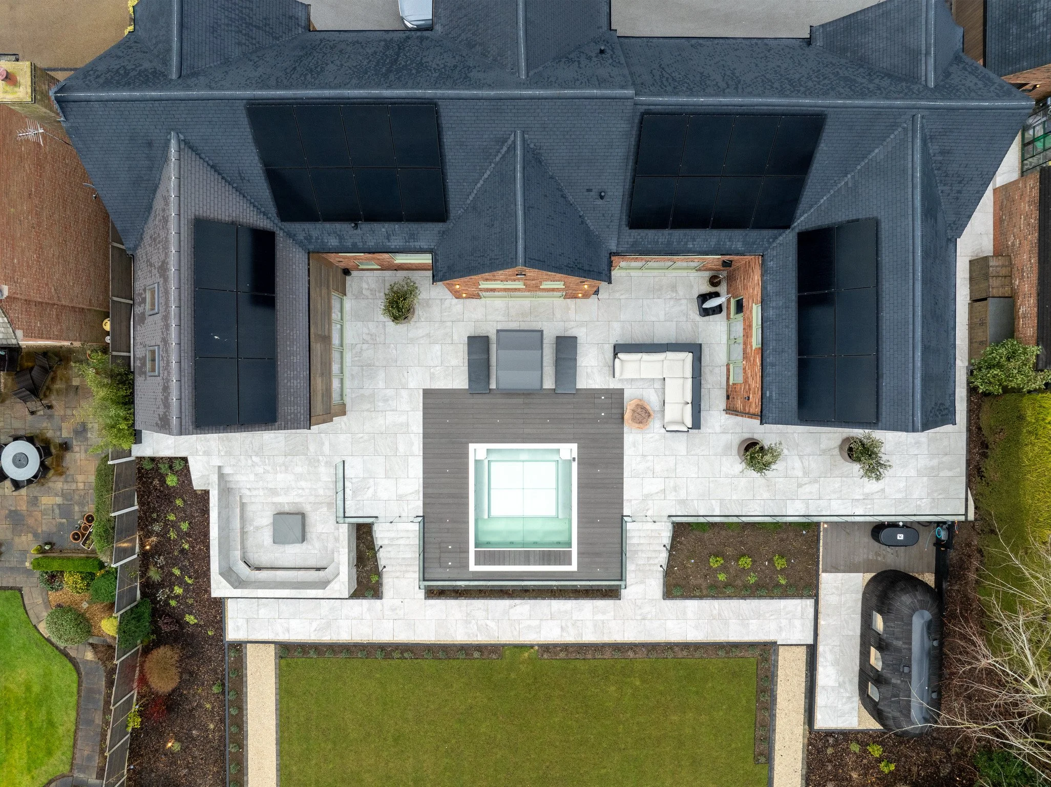 Aerial view of luxury garden redesign with lighting control and outdoor smart technology