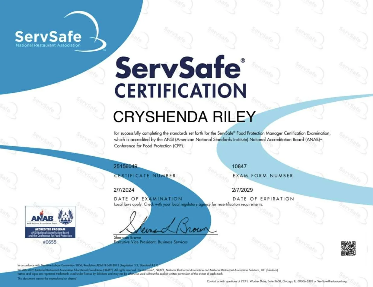 ServSafe certification awarded to Cryshenda Riley, valid until February 7, 2029, issued by the National Restaurant Association, signed by Sherman Brown.