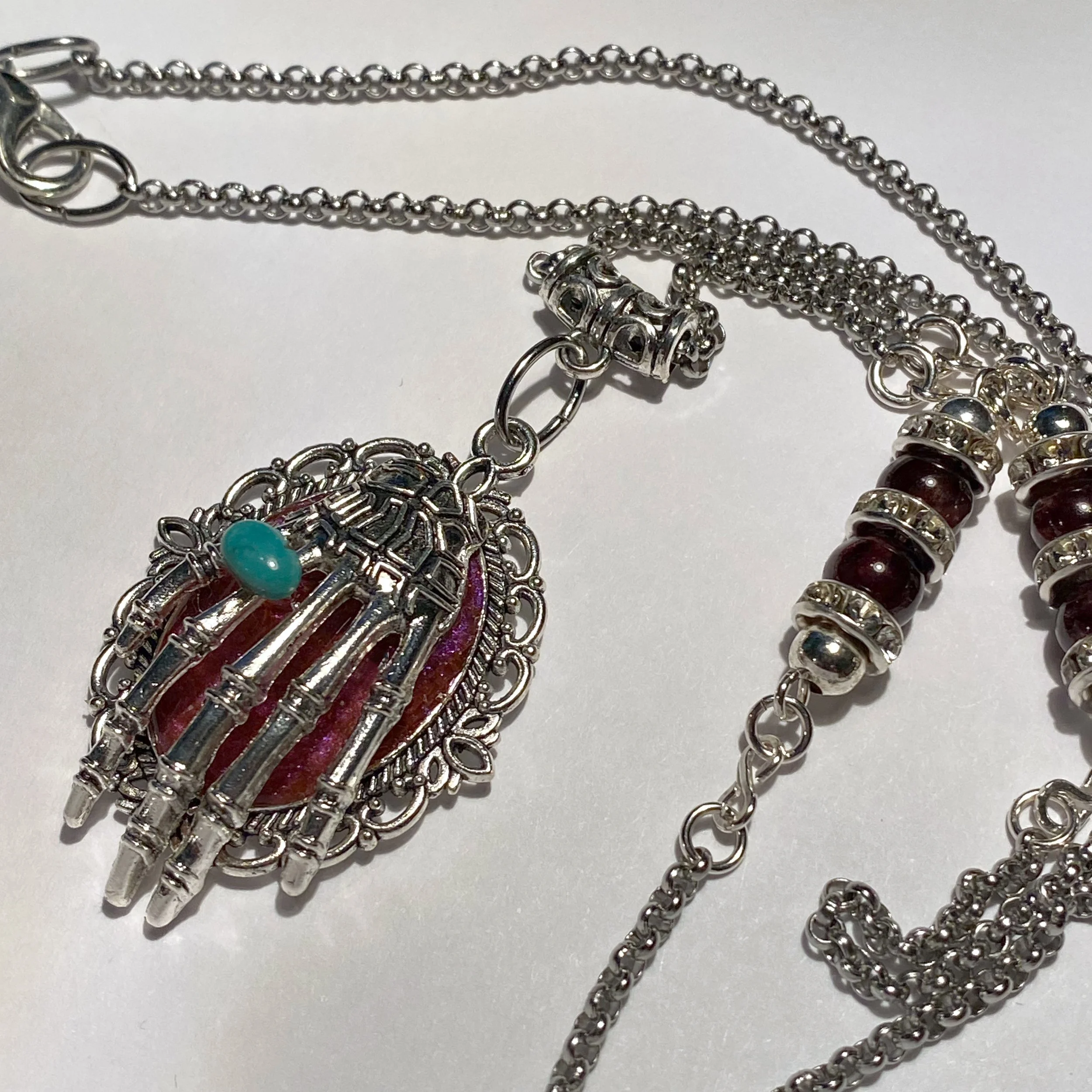 Captain's Last Clutch – Playful Pirate Treasure Pendant