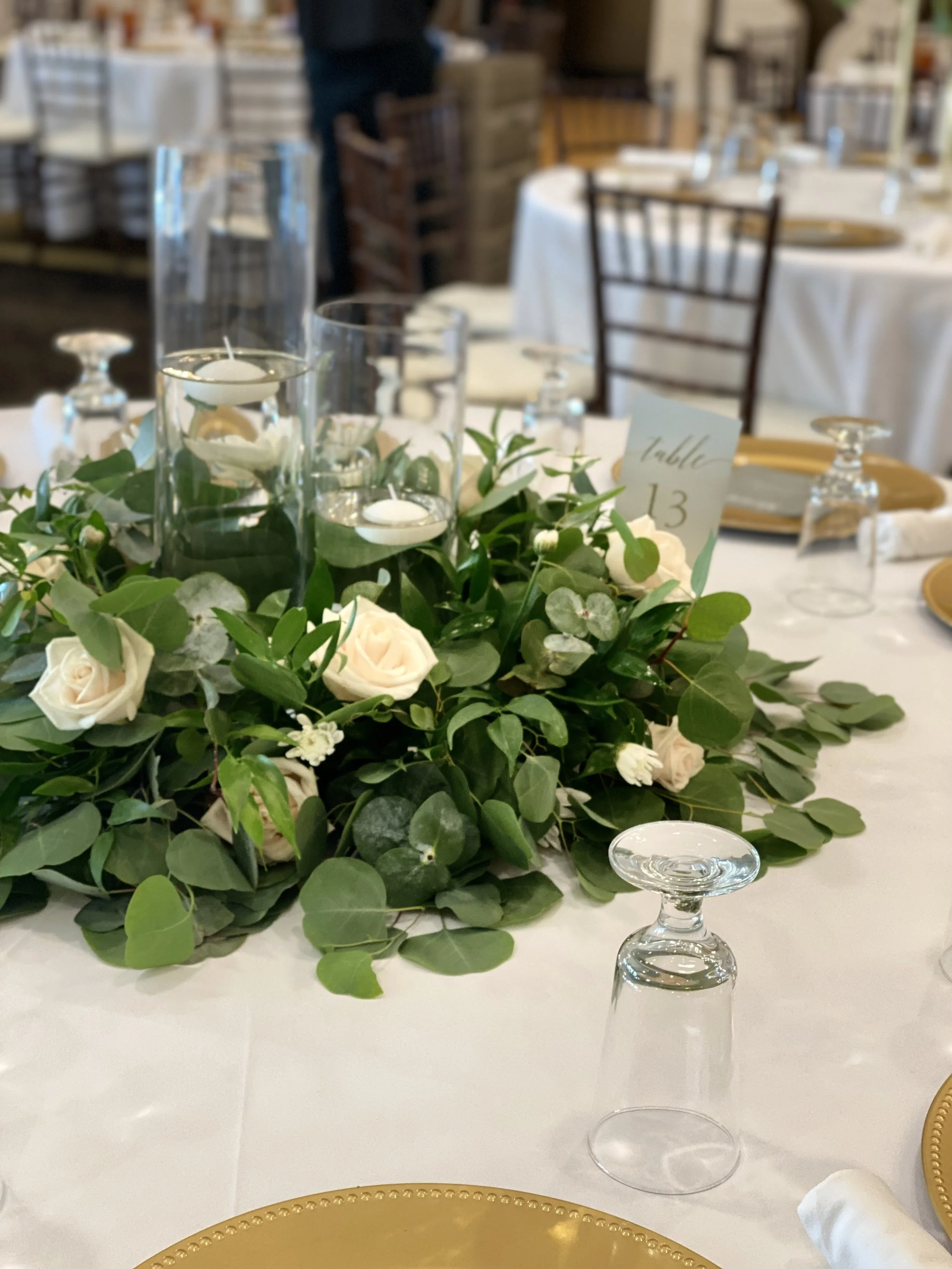 Elegant wedding centerpiece with white roses.