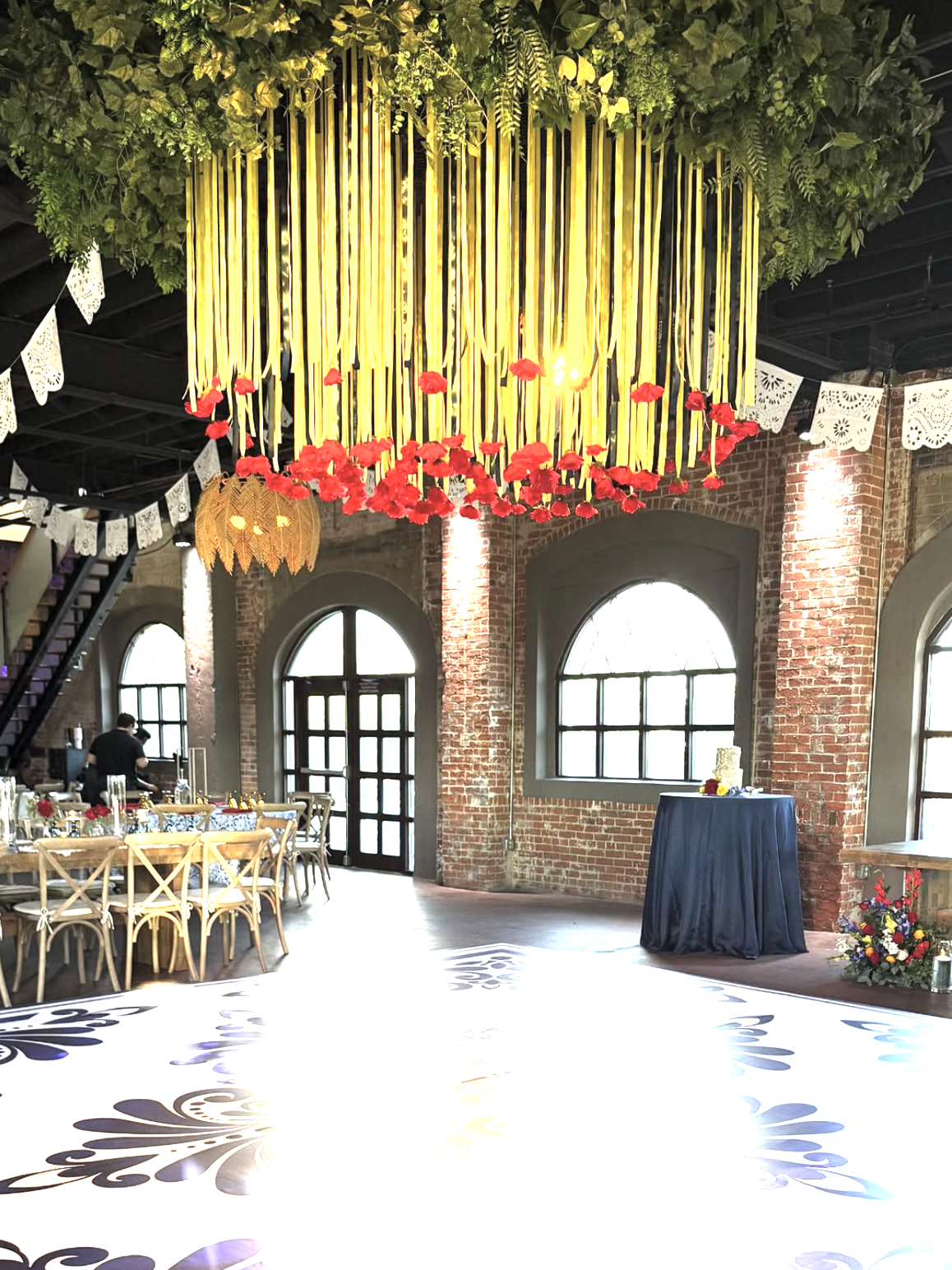Ceiling arrangement featuring red florals.