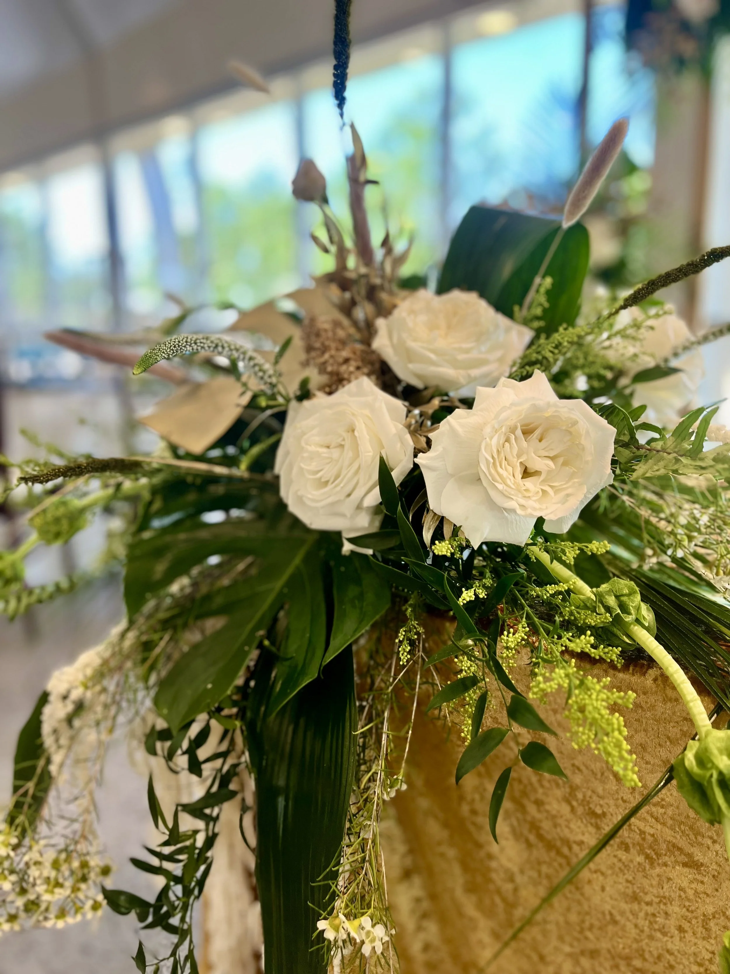 Close-up of a flower arrangement with white roses.