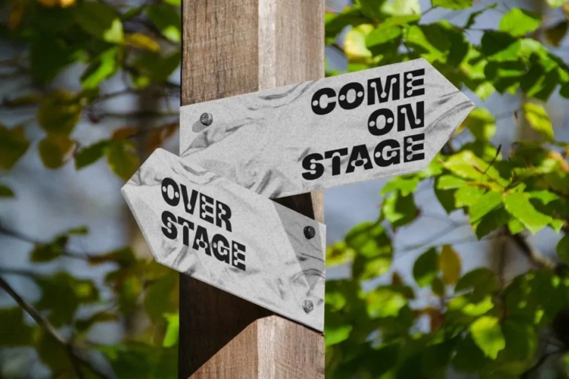 Way finding signage directing attendees to the Come On Stage and Over Stage at a multi-stage music festival, designed as part of a festival brand and environmental graphics concept by Kieren Dial.