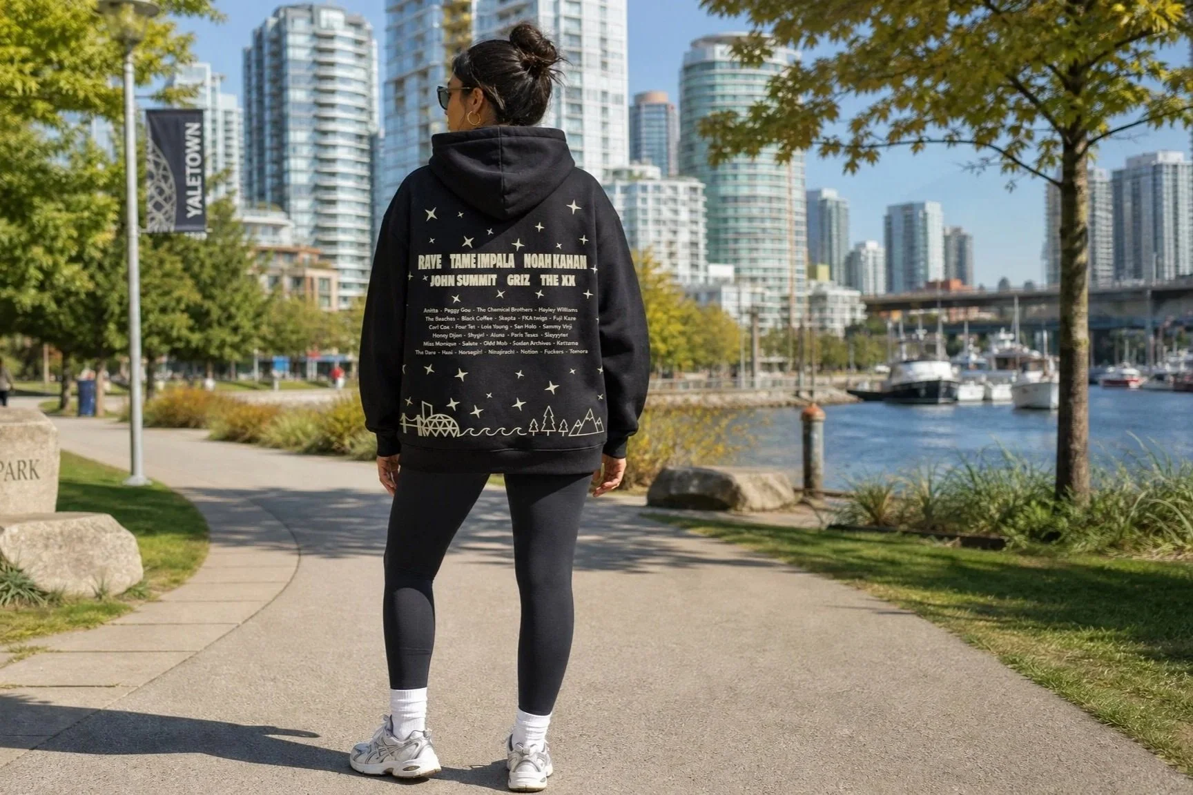 Range festival lineup branded hoodie showing the four stage world icons applied to merchandise and promotional materials 