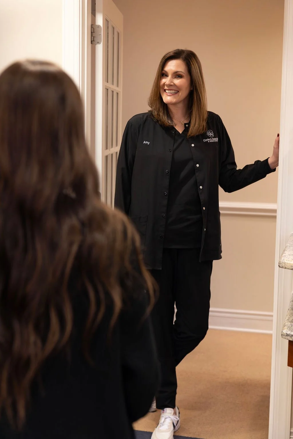 Dental Assistant Greeting Patient