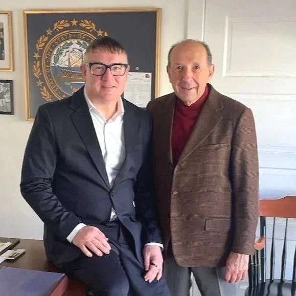 Capt. John McGunnigle and John Ranelli casually dressed in office