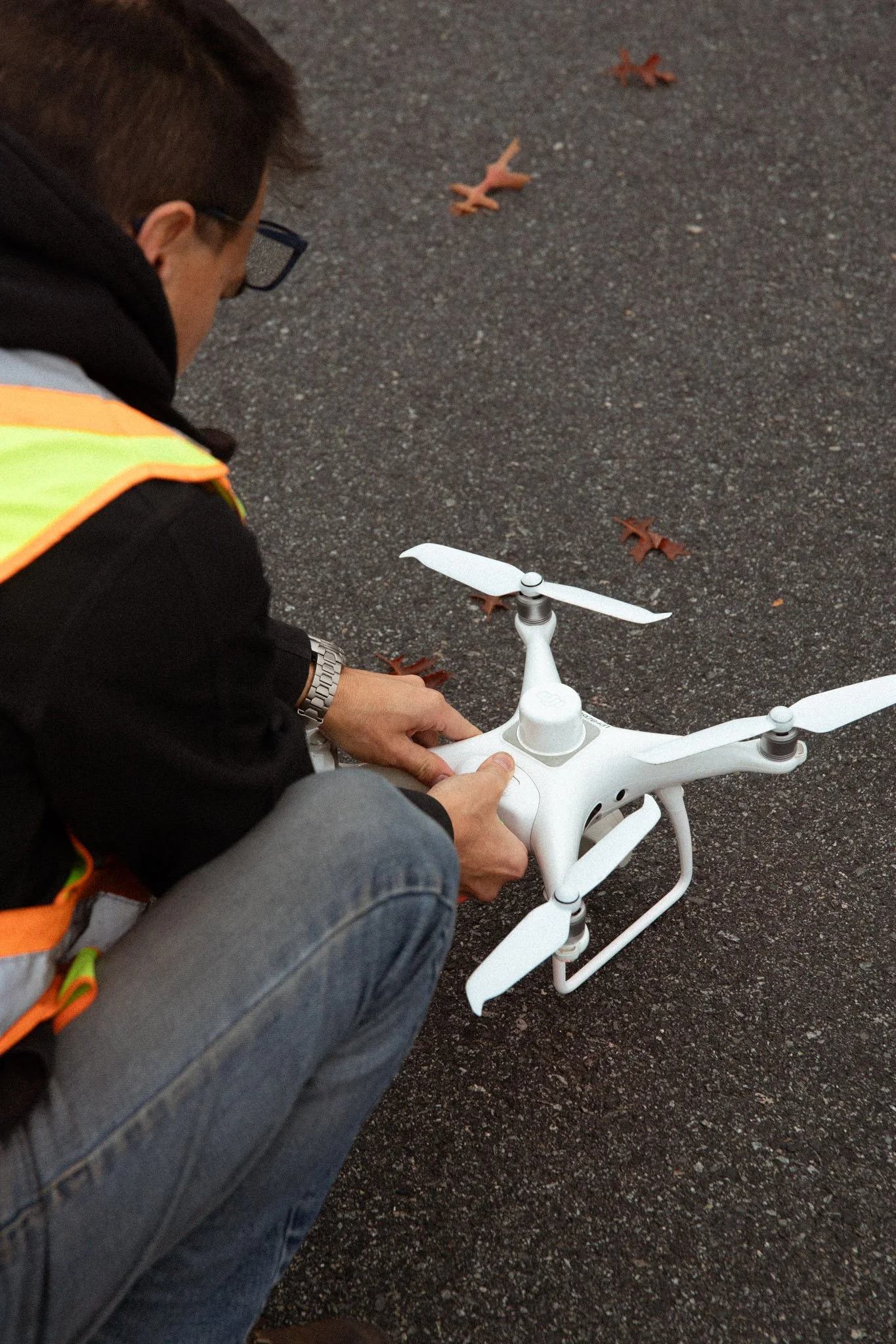 Pre flight check on drone with Stefan Tam of Send in the Drones