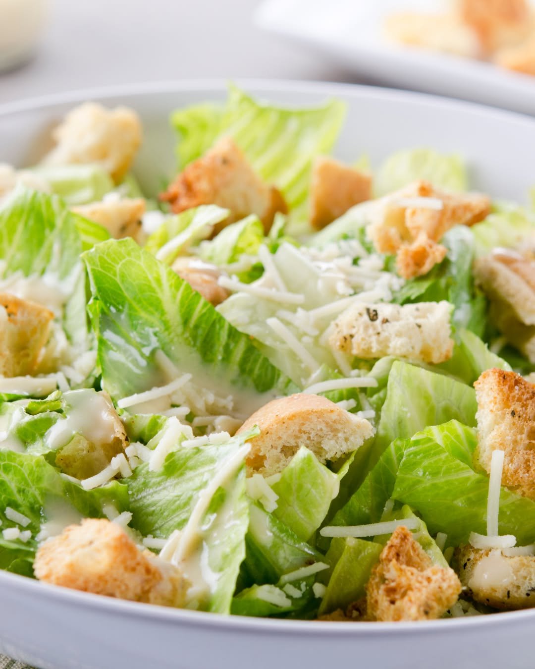 A summer classic: crisp romaine, bold Parmesan, and that perfect Caesar bite. Fresh, light, and made for warm‑weather dining!