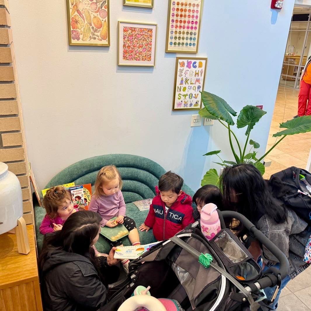 Attending a Stay and Play? 

Bring your kiddos into the cafe to enjoy our &ldquo;cozy corner&rdquo; with a curated selection of multicutural baking books, colorful art, and a low-sitting couch that little legs can hoist up to easily.

We offer small 