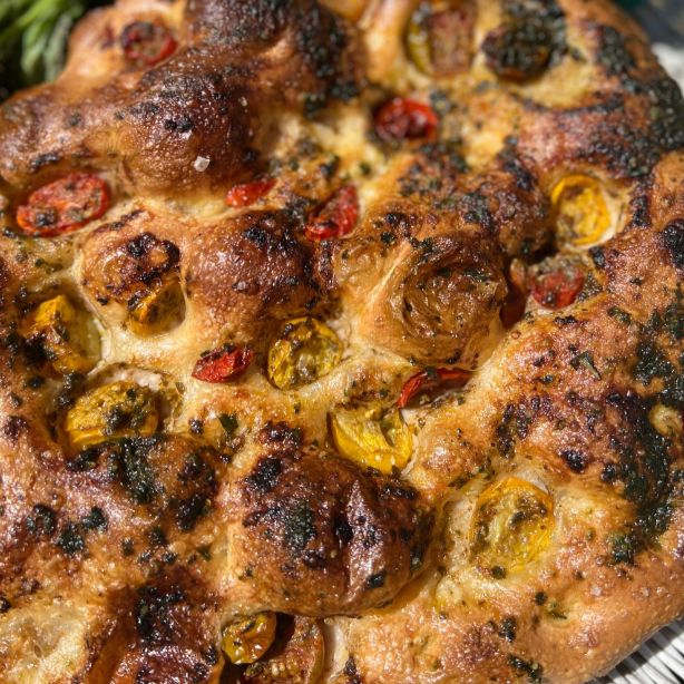 Slightly sweet and acidic cherry tomatoes are enveloped in our AKB homemade pesto, and dimpled into our focaccia dough. Each bite bursts with flavor.