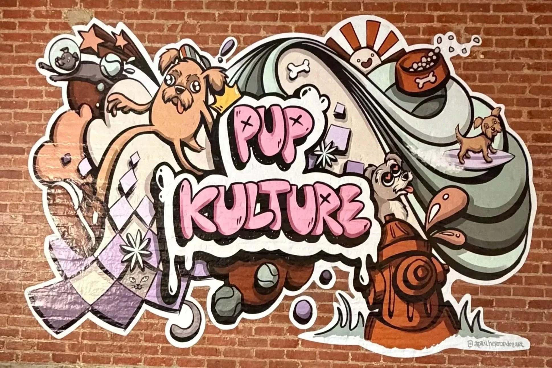 Mural that says, "Pup Kulture" with a few dogs.
