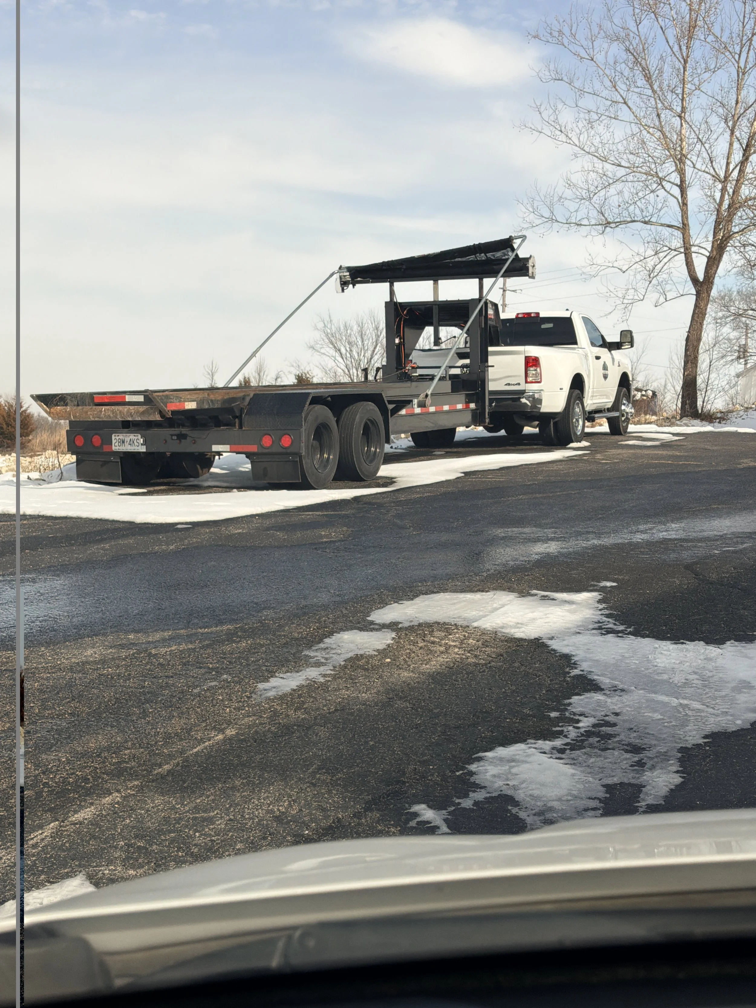 Pass N Trash dumpster rental truck and roll-off trailer serving Lake of the Ozarks, Missouri.