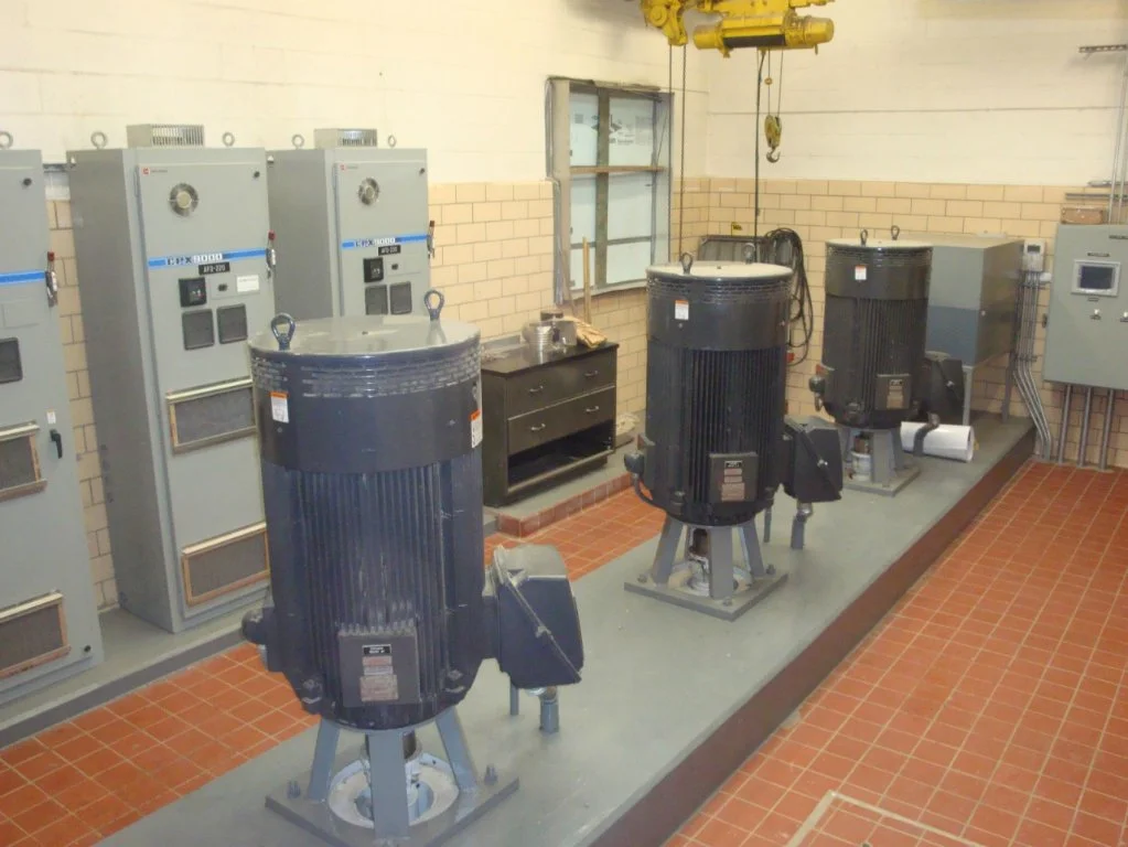 4. Influent Pump Room:
The influent pumps accept the screened wastewater and transfer it to the aerated grit chamber (AGC). Each pump is capable of pumping 9 million gallons per day,(MGD) with a total capacity of 27 (MGD). These pumps are equipped wi