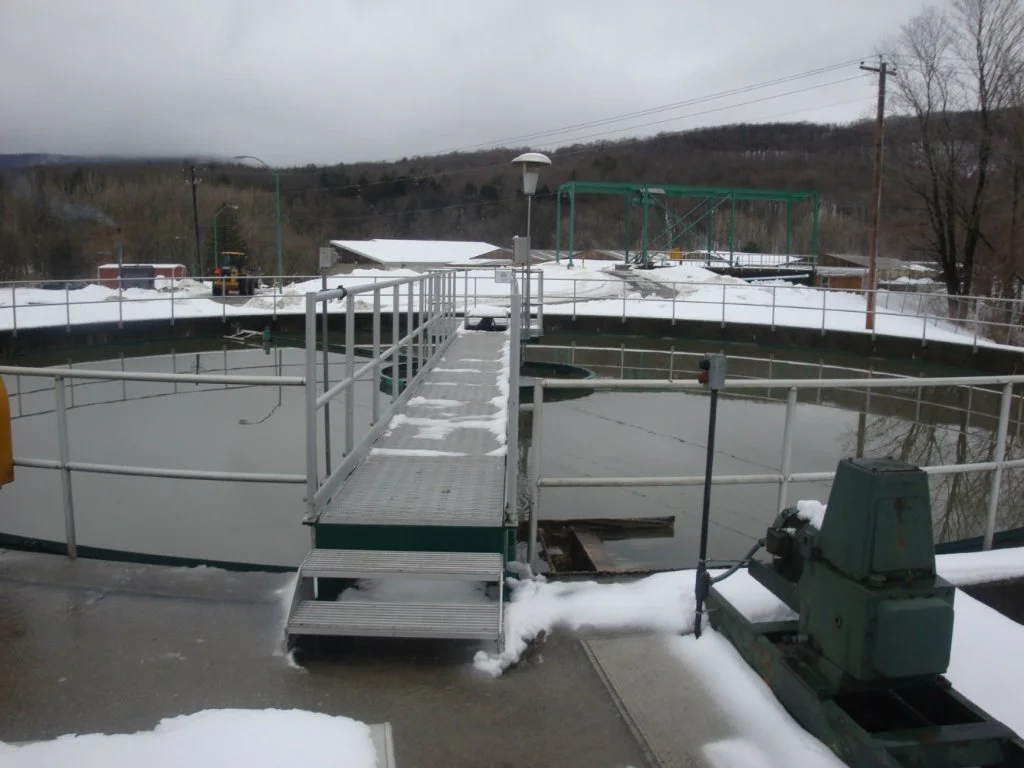 6. Primary Clarifier:
The existing primary treatment system consists of two circular clarifiers, each 75 feet in diameter.  Settled primary sludge is transported to the hopper near the center of each clarifier via a rotating collection mechanism.  Th