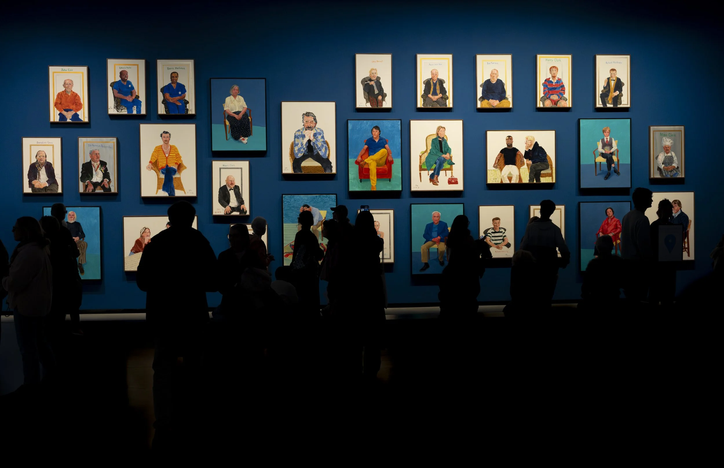 In this photo, I captured the portraits Hockney painted of his friends, family, and others. These were among my favorites — the way they stand out against the blue background makes each painting feel almost like a photograph.