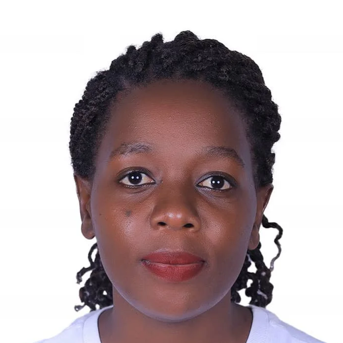Headshot of a Black woman with braided hair, looking directly at the camera against a plain white background.