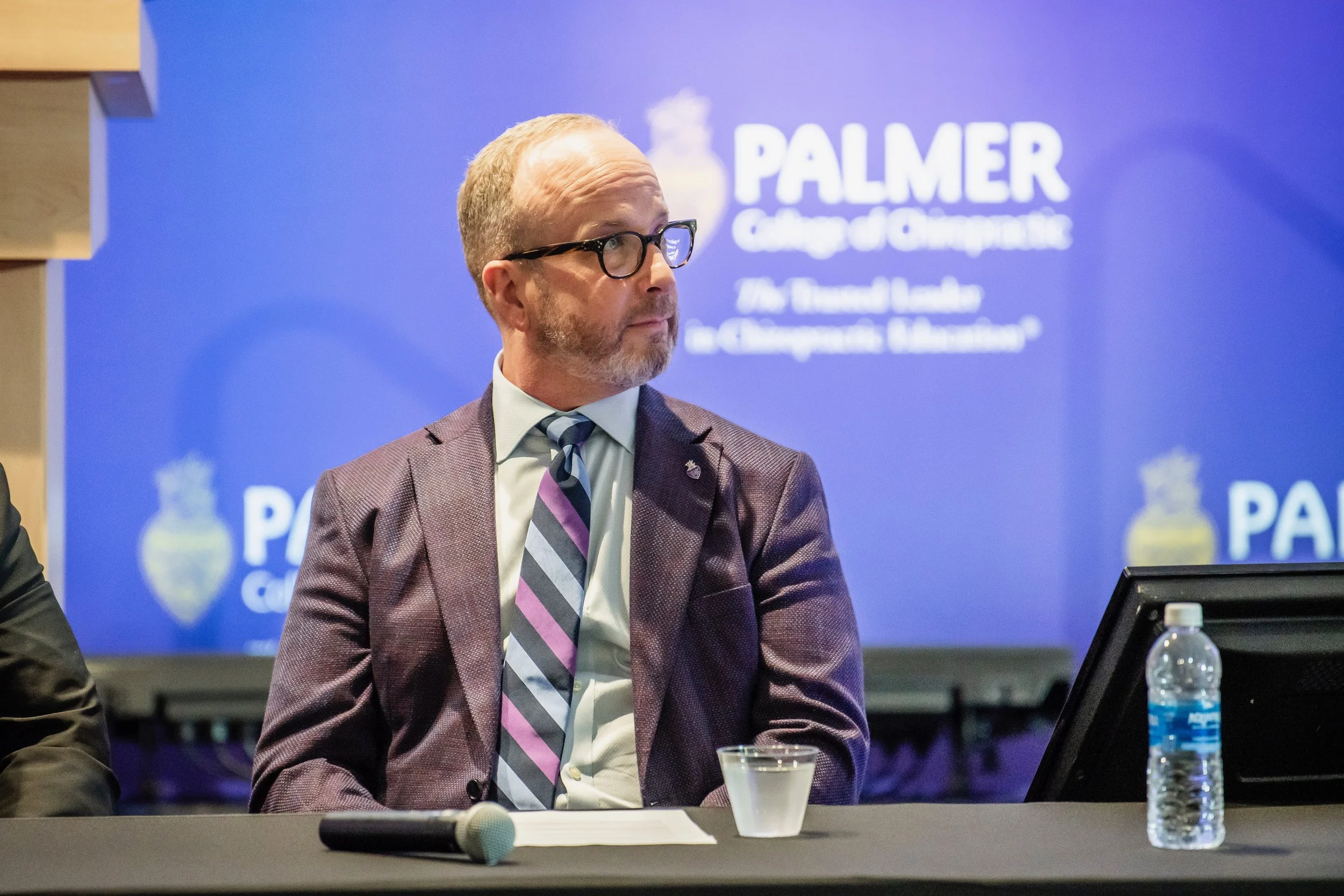 Dr. Eric Russell participating in a professional event at Palmer College of Chiropractic.