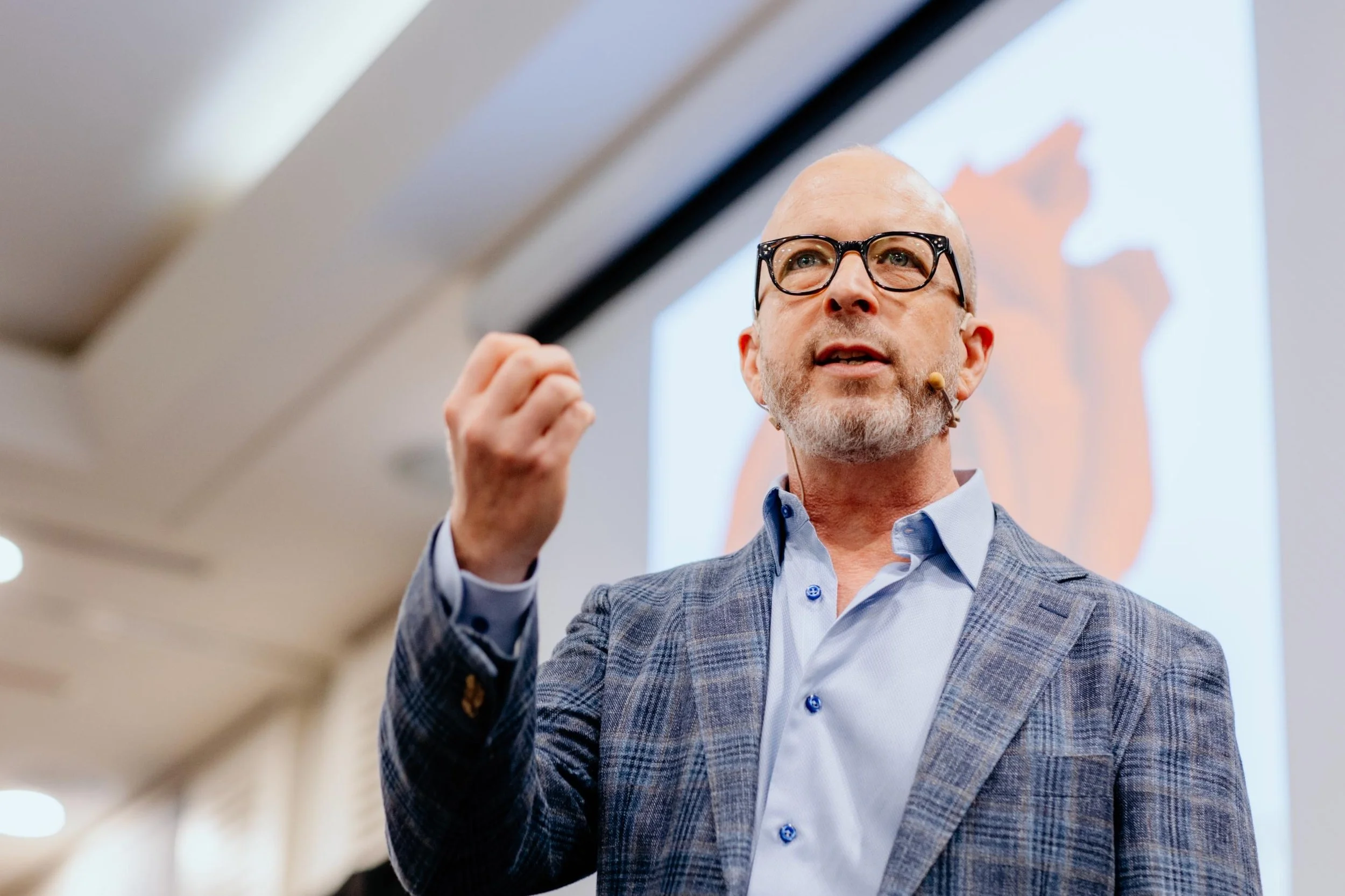 Dr. Eric Russell speaking about chiropractic philosophy at a professional chiropractic event.