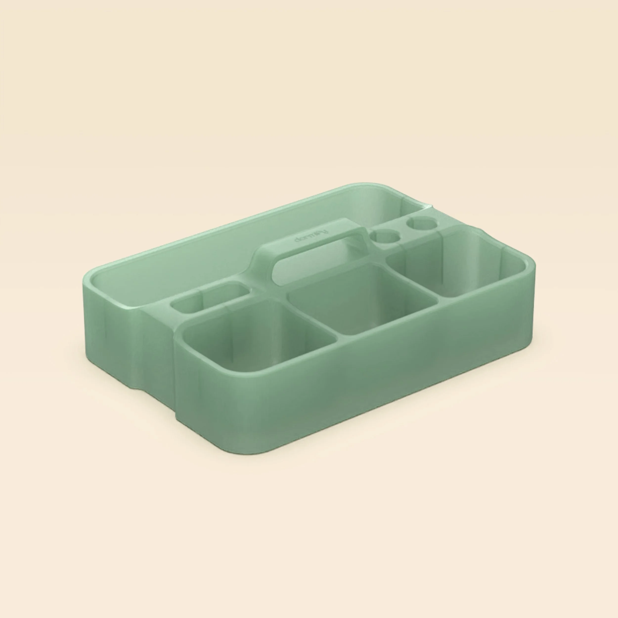 Mint green plastic organizer with multiple compartments placed on a neutral background.