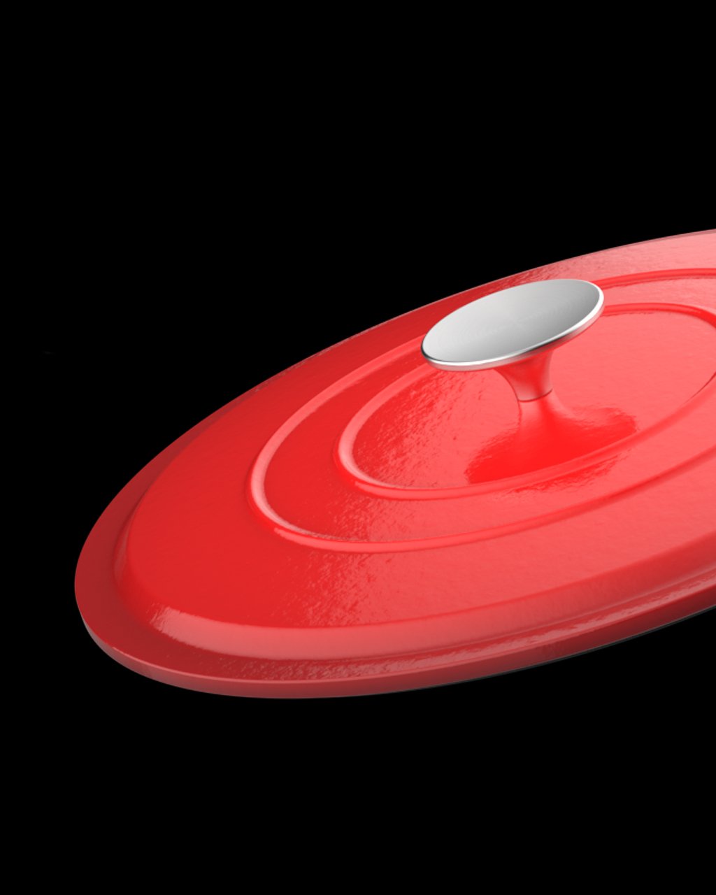 Close-up of a red, circular, unlidded frying pan with a silver knob on a black background.