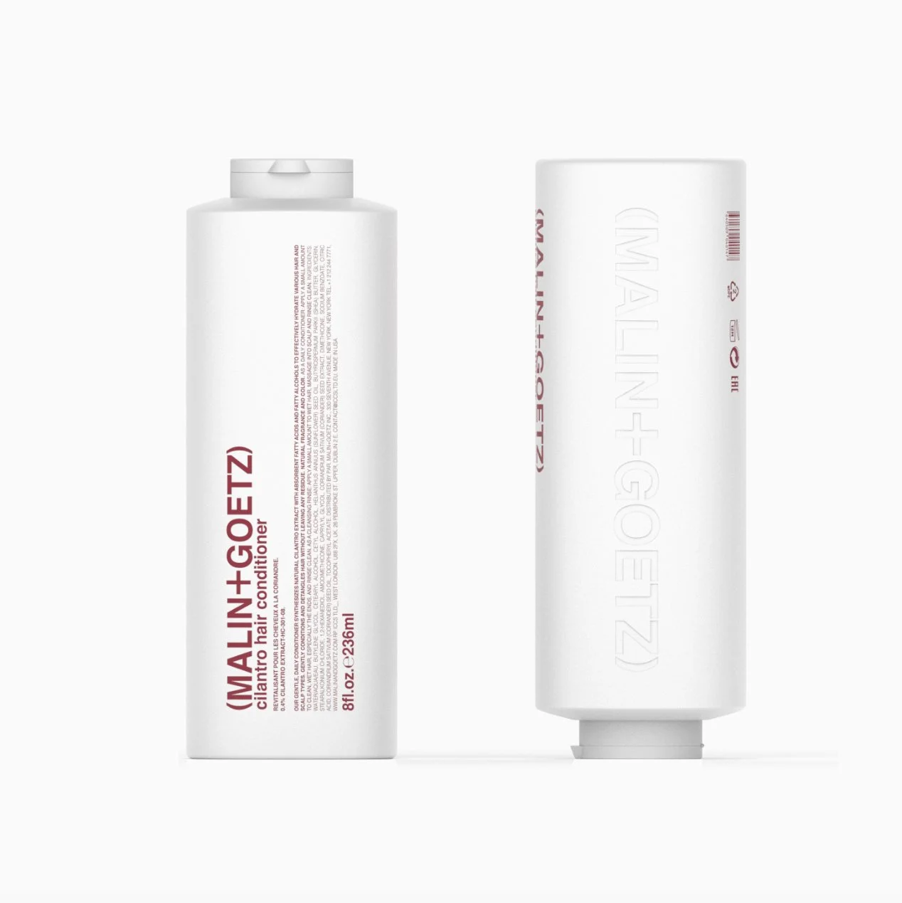 Two white bottles of IMALIN+GOETZ hair conditioner, one upright showing the label and the other lying horizontally showing embossed branding.