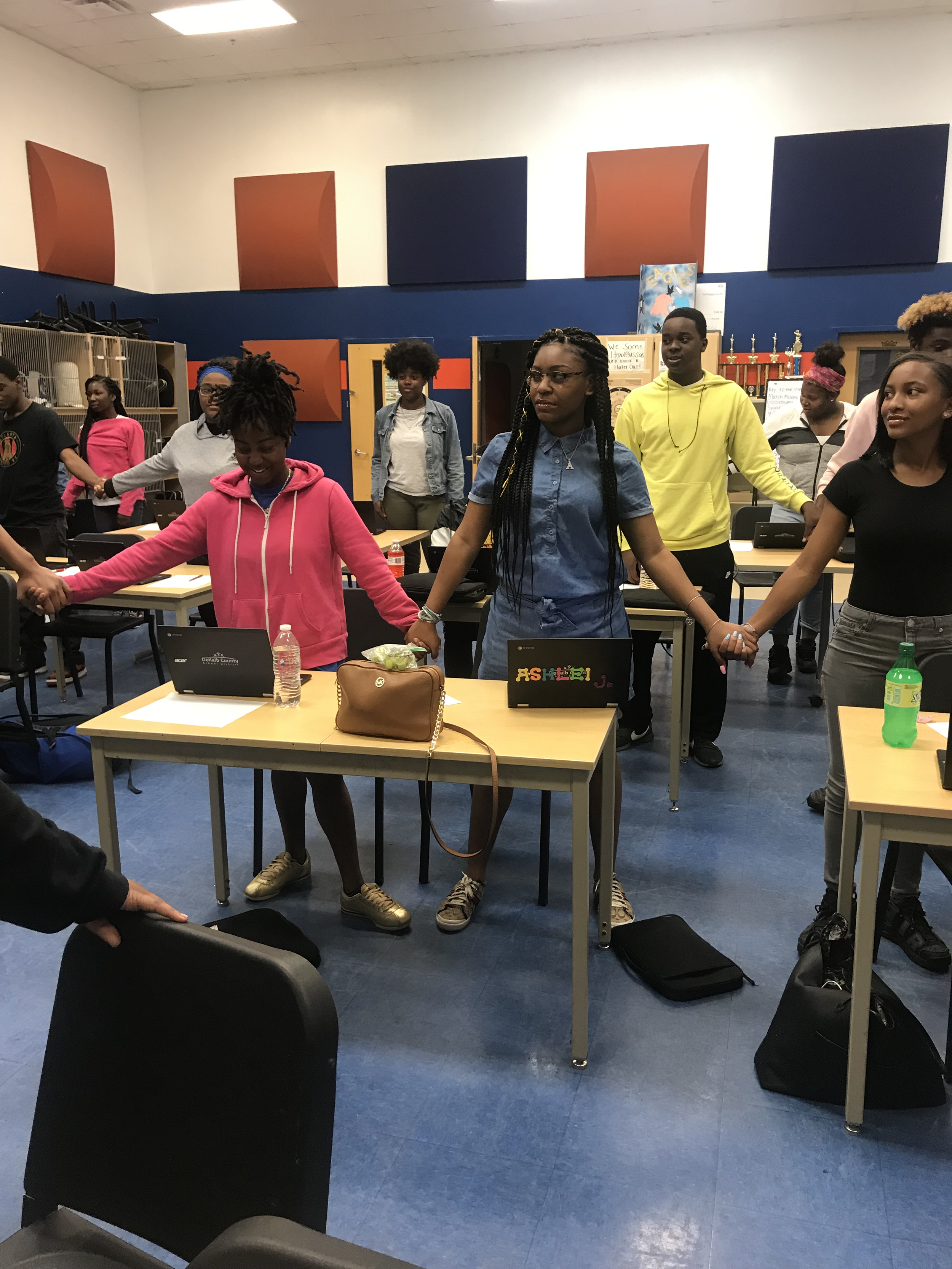 Learners holding hands