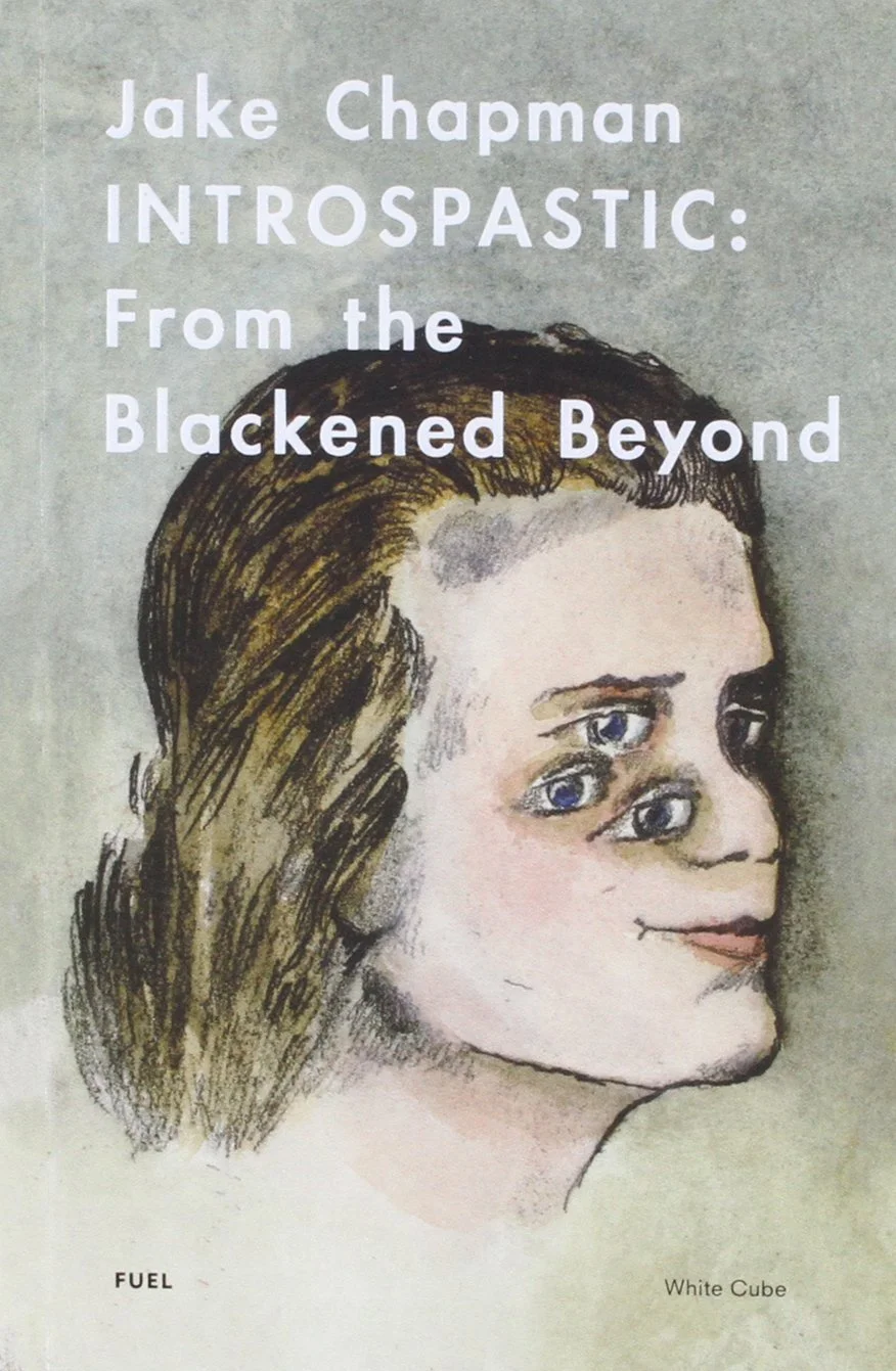 Book cover of "INTROSPOSTIC: From the Blackened Beyond" by Jake Chapman featuring a drawing of a woman's face with multiple eyes and wavy hair, with the title and author's name in large white text.