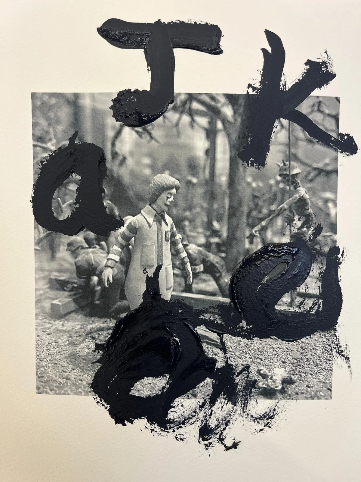Black and white photograph of children playing outdoors, with large black painted characters overlaying the image.