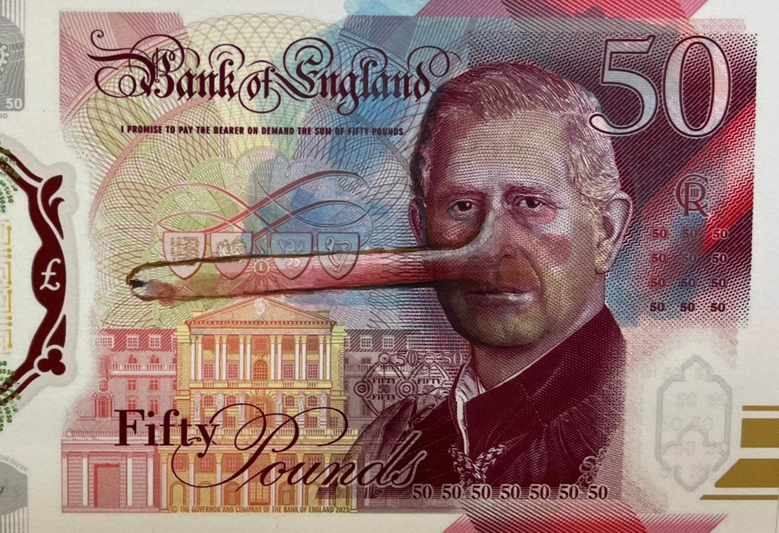 A modified 50-pound banknote from the Bank of England shows a man with a long finger touching his nose.