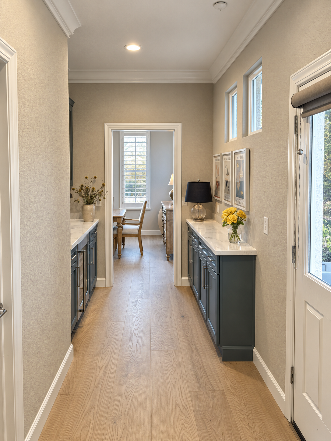 Deep green cabinets with white quartz countertops along a hallway with wide-plank flooring, kitchen remodel in Cupertino, CA