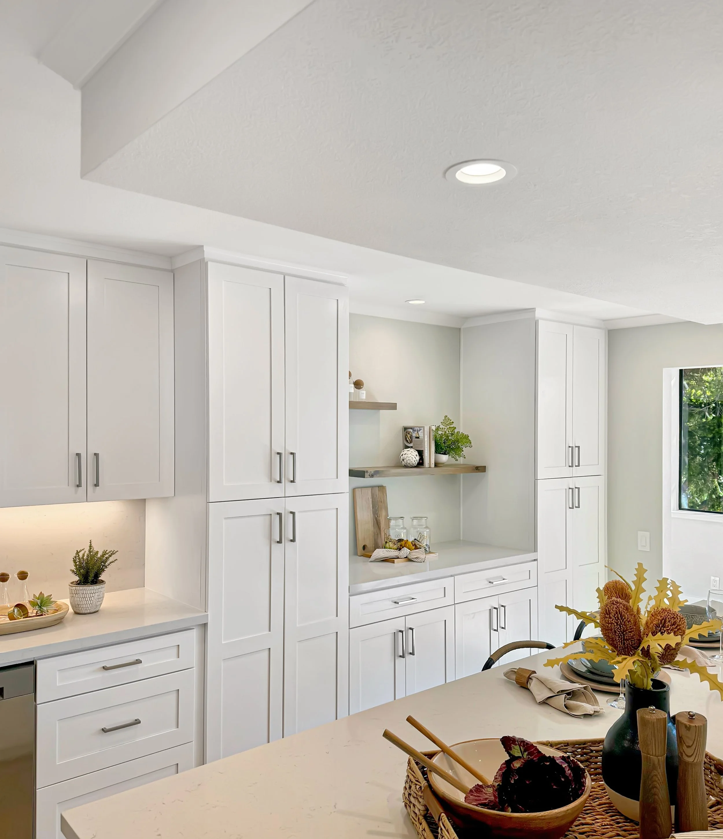 White shaker cabinets with under-cabinet lighting and recessed lights, kitchen remodel in Sunnyvale, CA