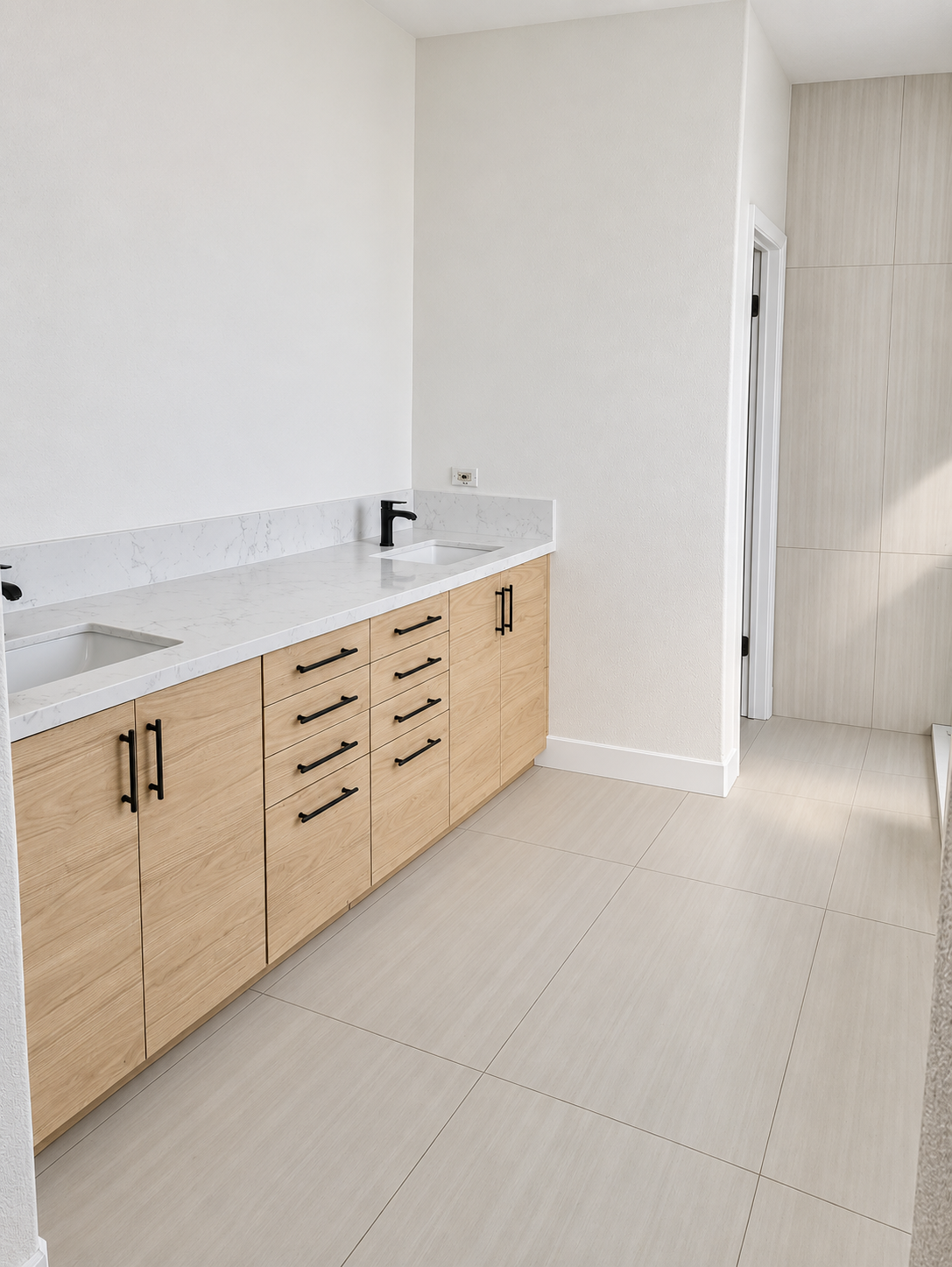 Double-sink wood vanity with a white countertop and black handles, bathroom remodel in San Carlos, CA